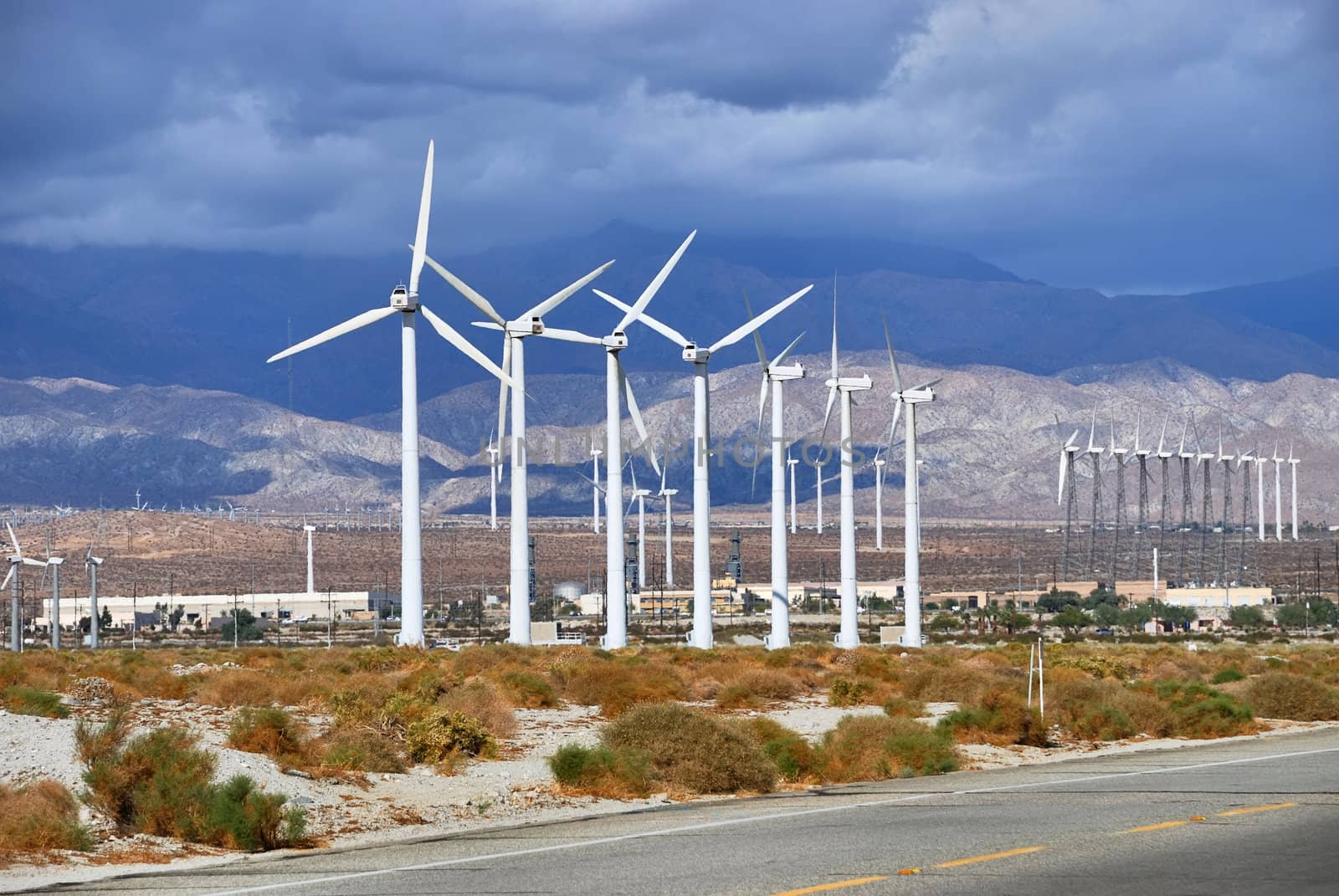 Windmills rotating and producing clean energy, electric power.