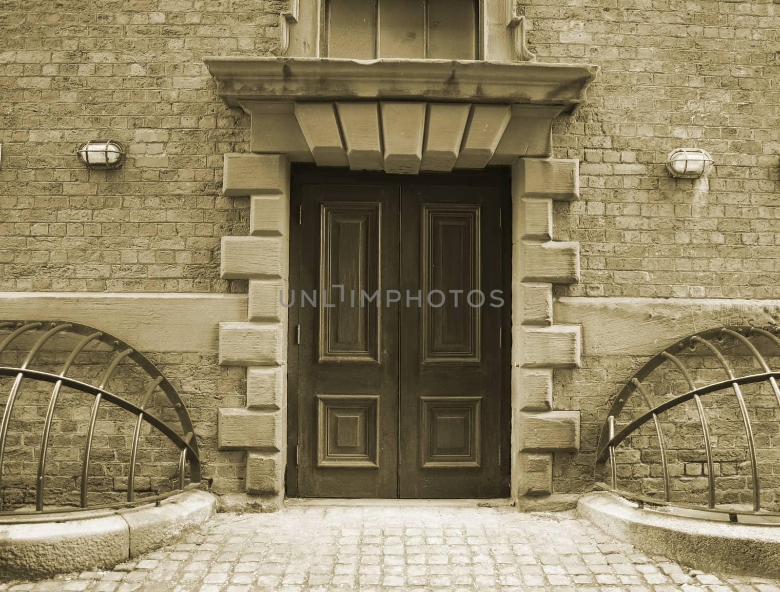 Entrance door with ornate stonework in a very old building (1824)