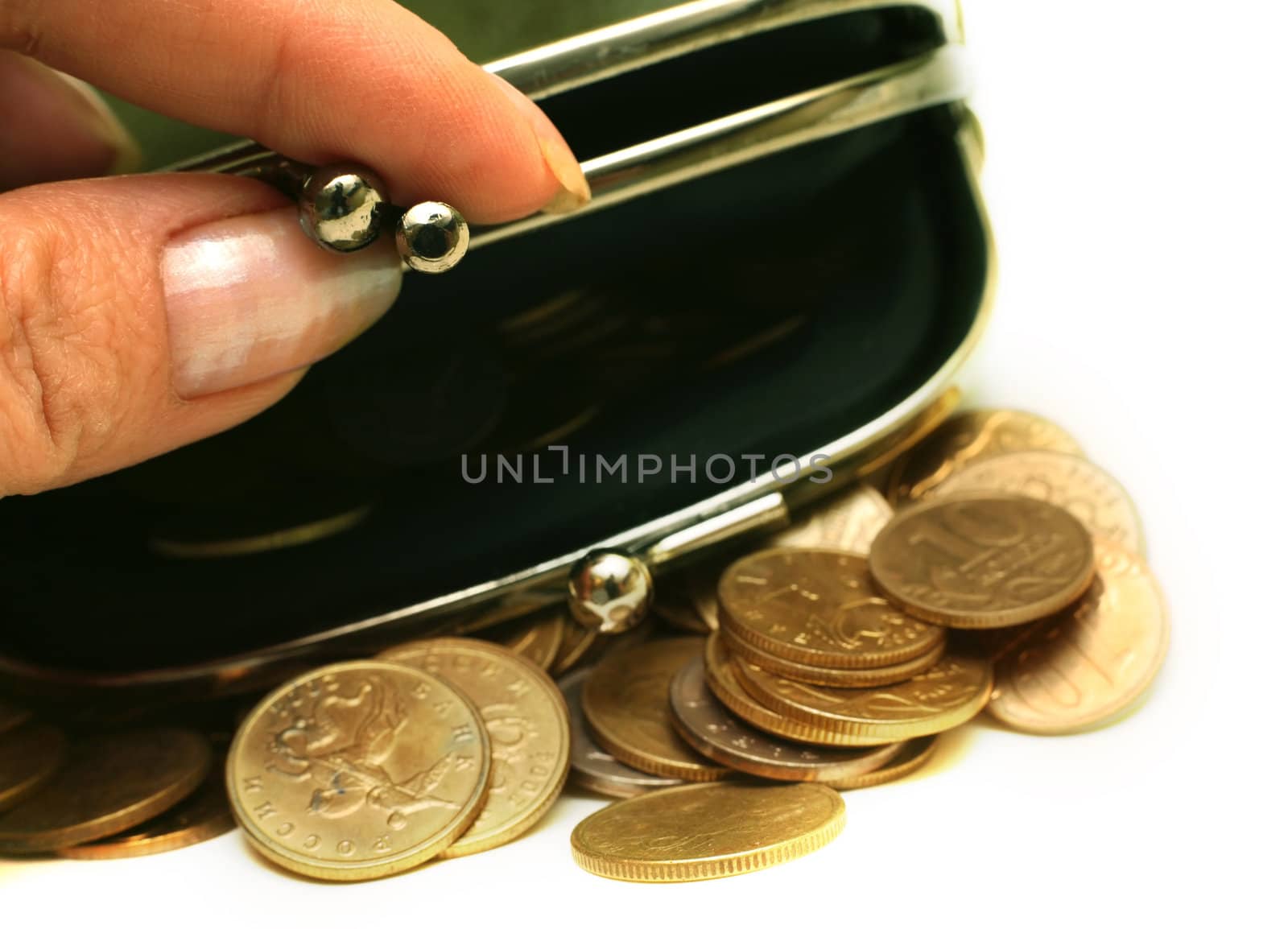 Female fingers open a purse with Russian coins