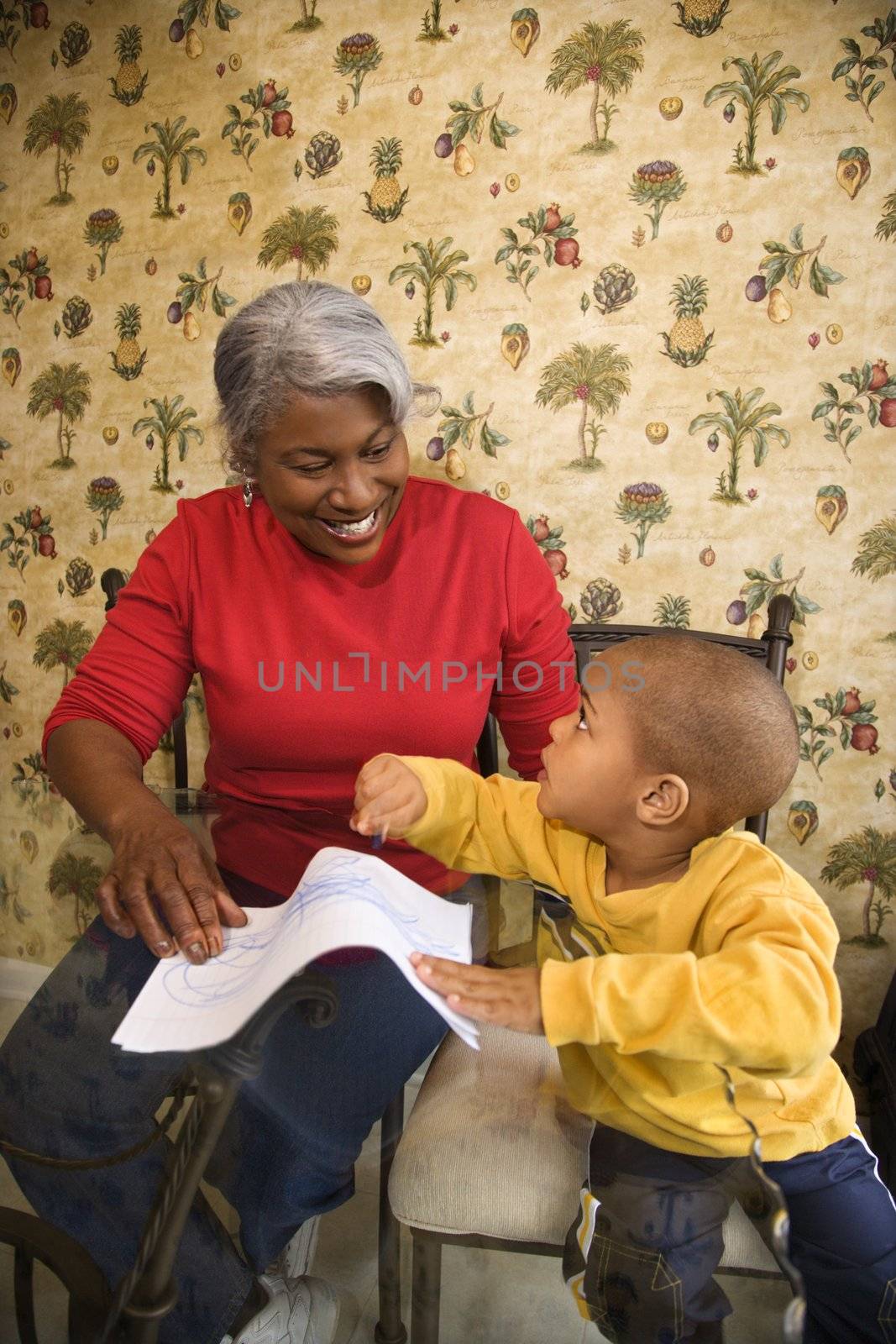 Grandmother and grandson coloring. by iofoto