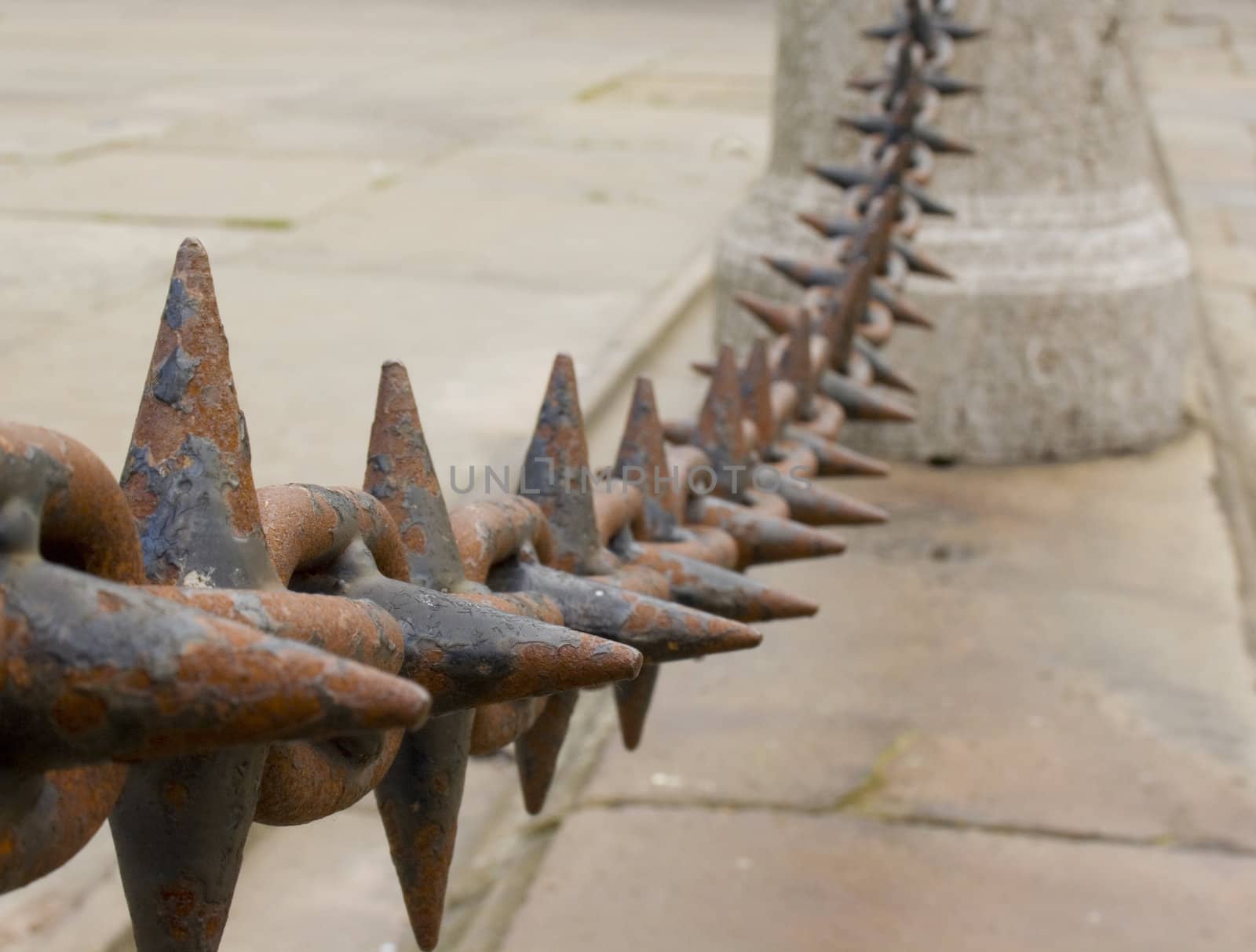 Close up of rusted spiked iron railings