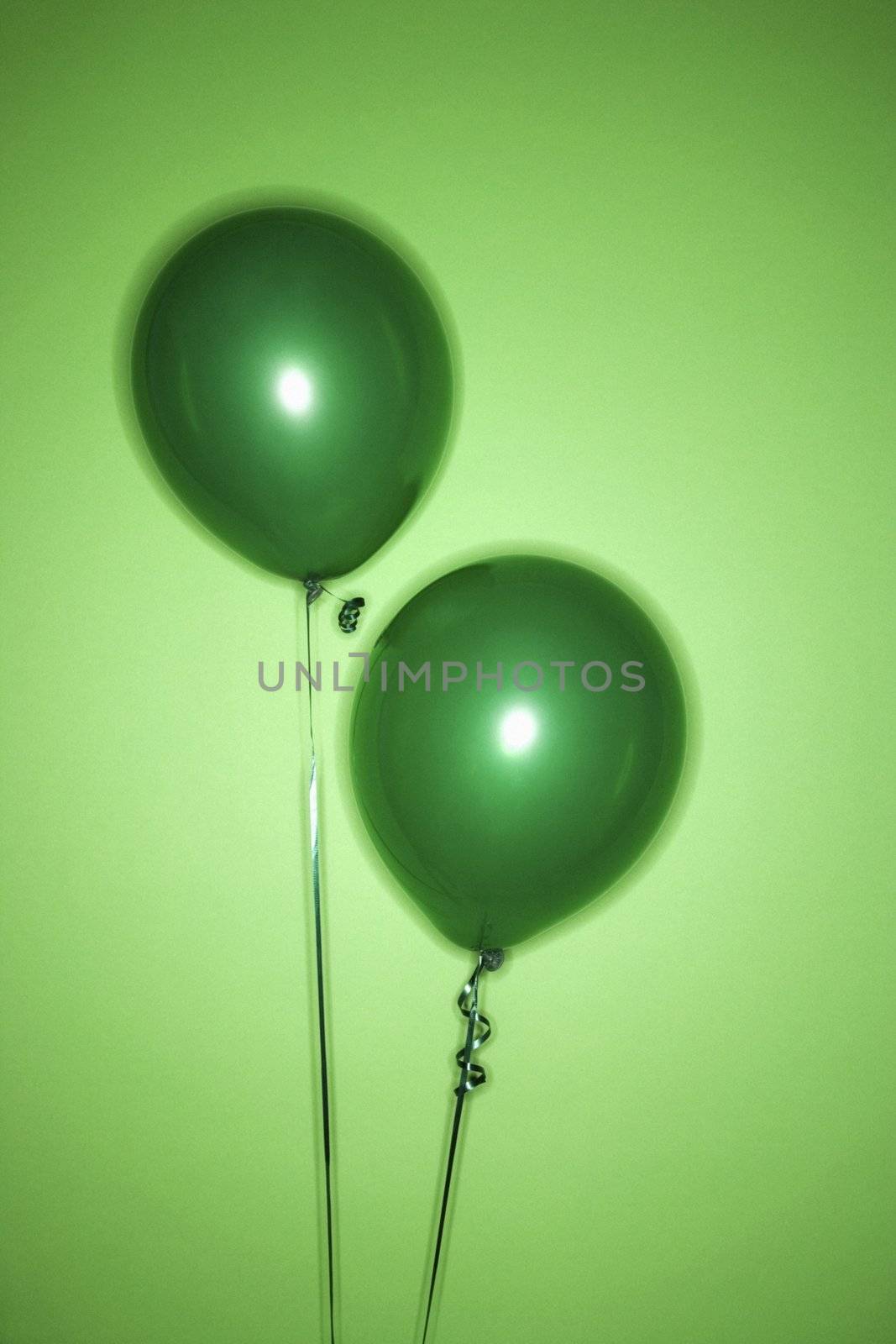 Two green balloons. by iofoto