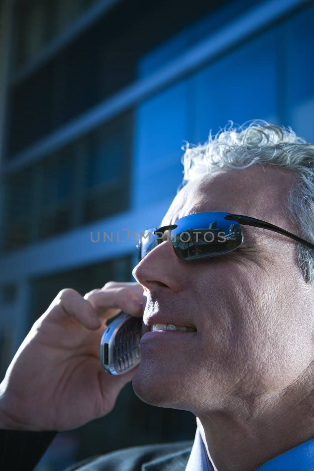 Man talking on cellphone. by iofoto