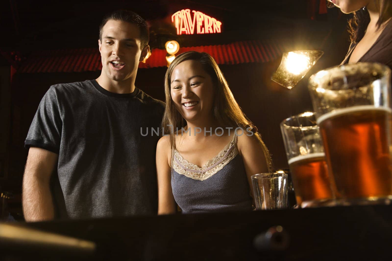 Couple at bar. by iofoto