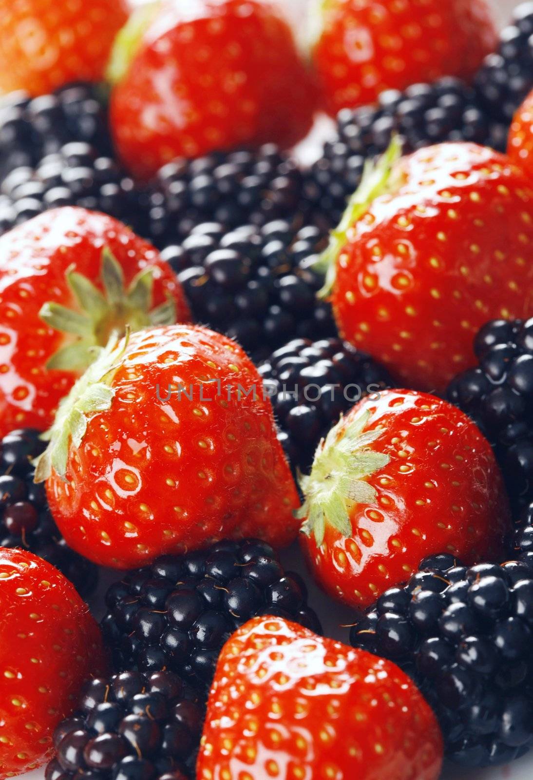 Strawberries and blackberries - shot in studio with a 21 megapixel camera