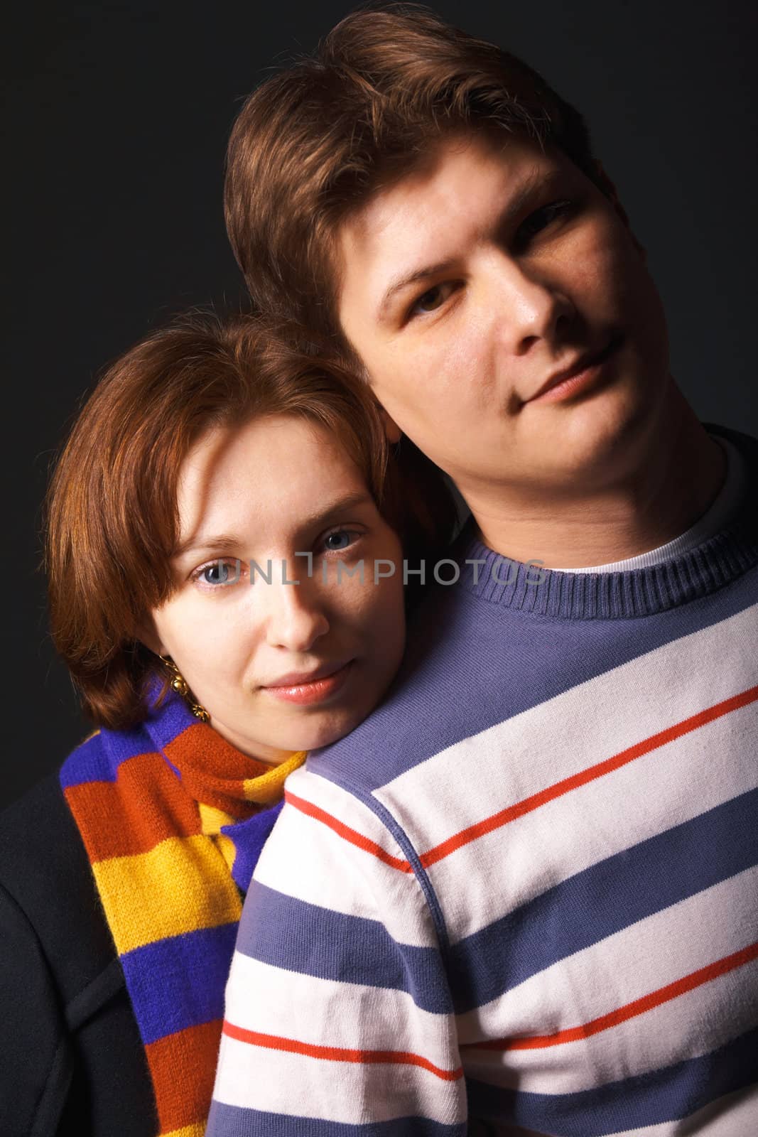 Close-up portrait of a young couple by romanshyshak