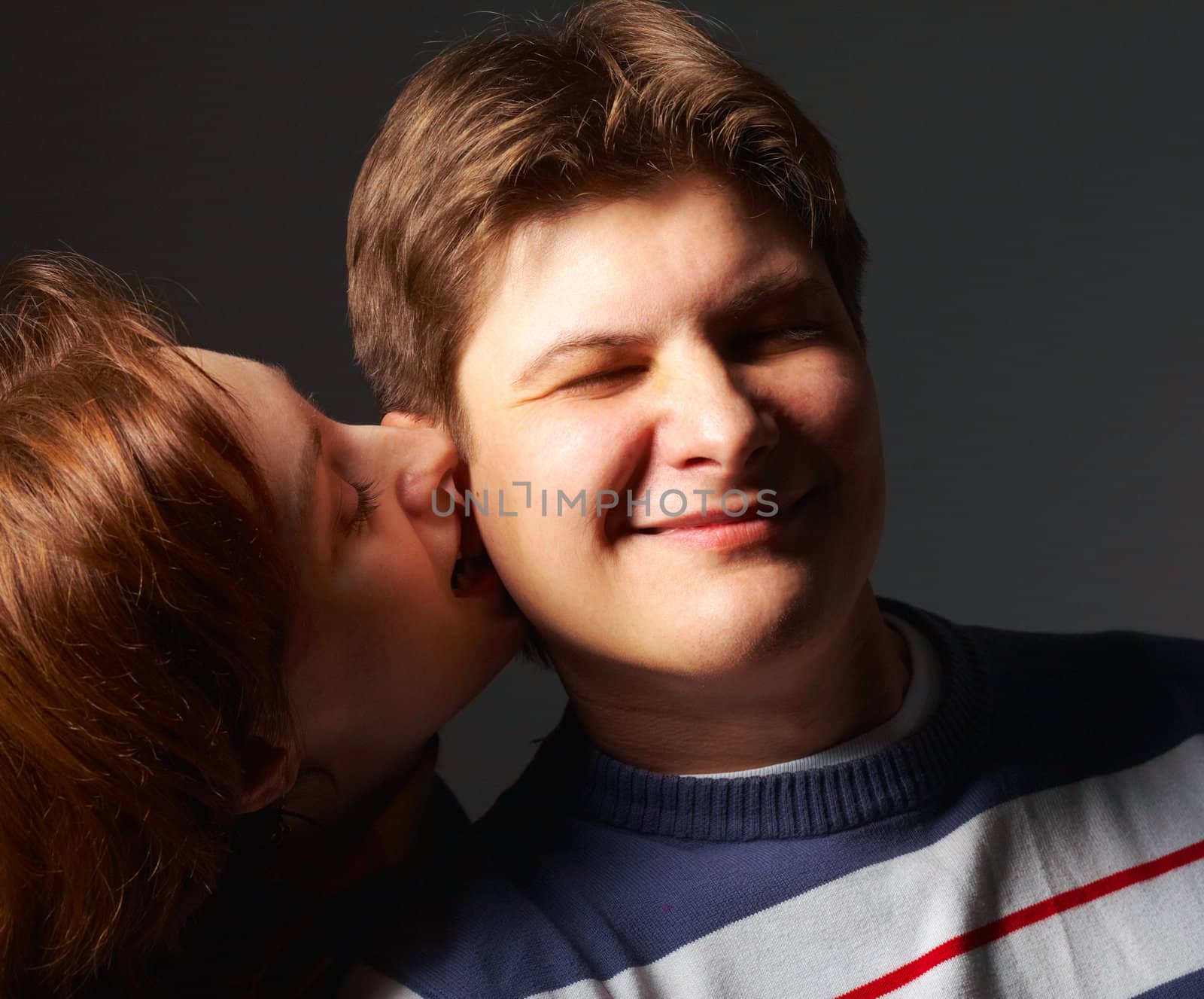 Attractive couple portrait. Close-up view