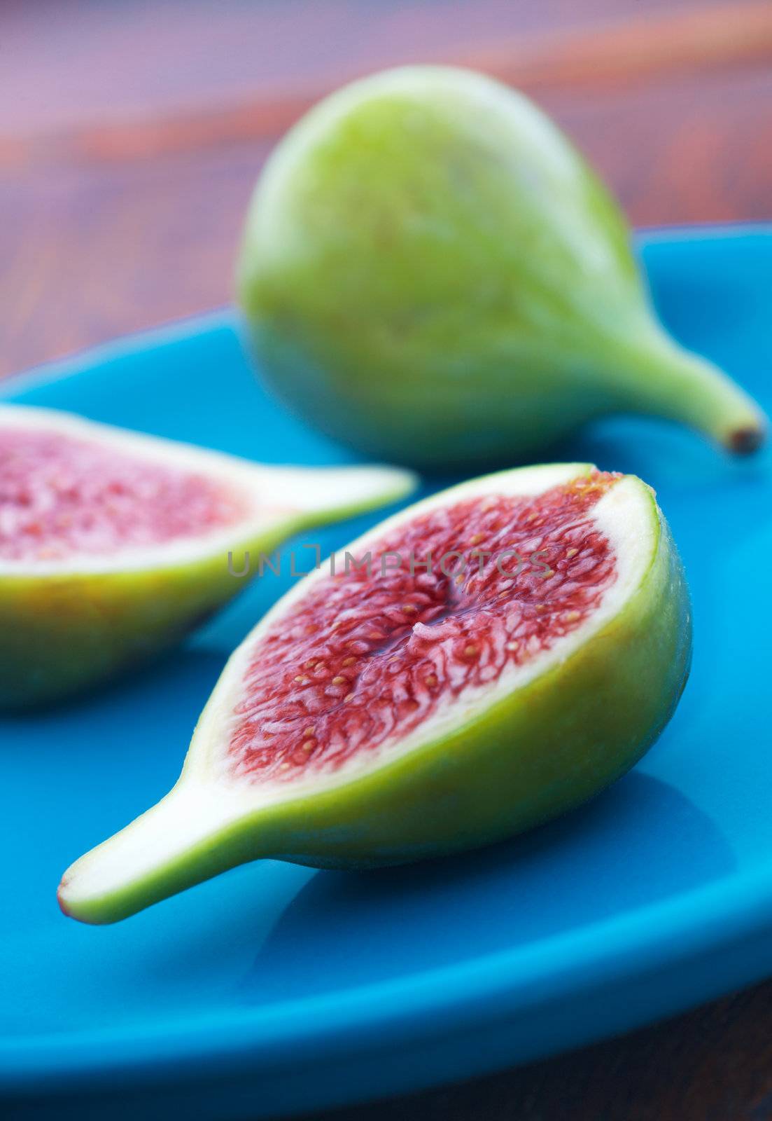 Delicious vibrant honey sweet green fig. Figs halved