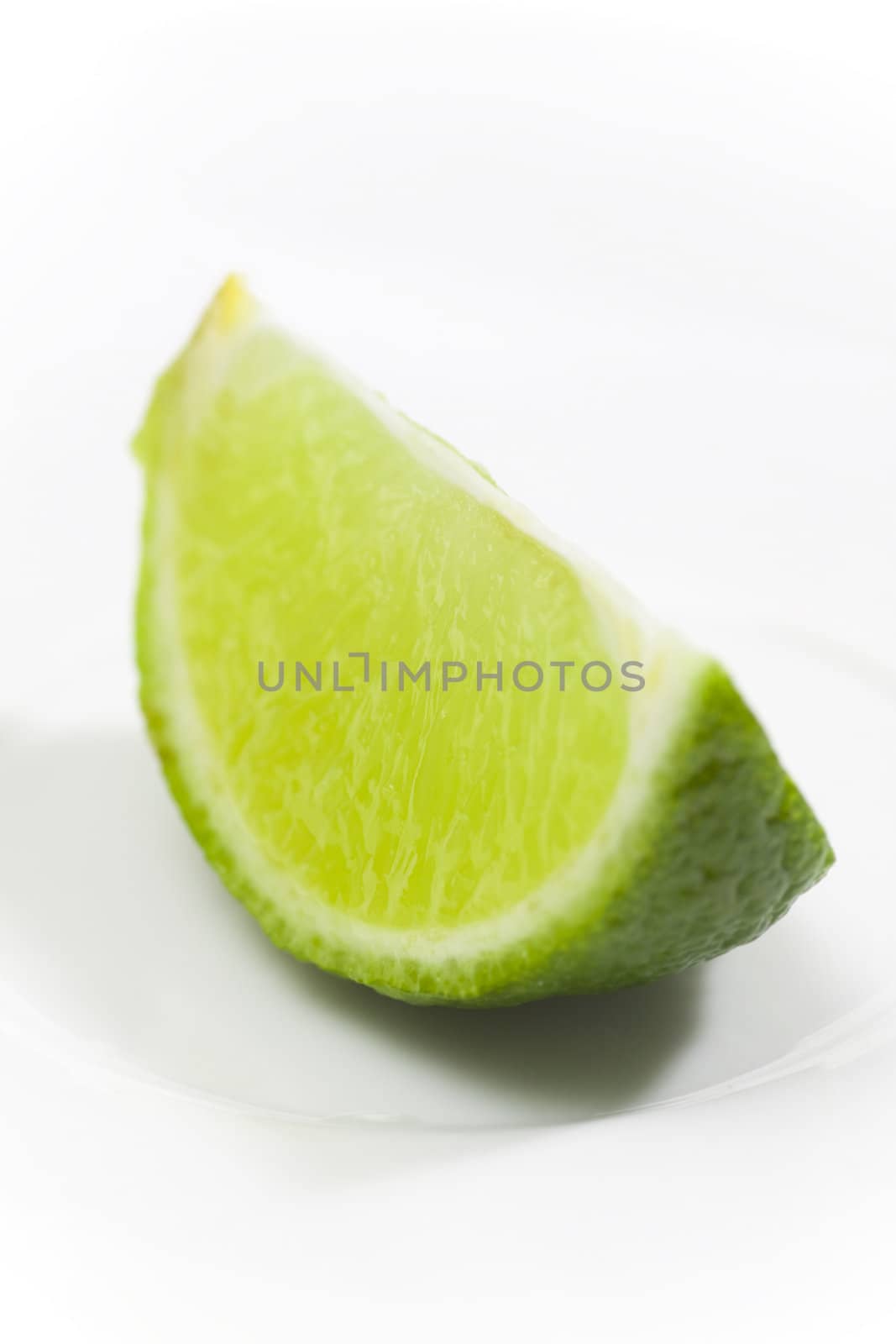 Fresh lime on white plate