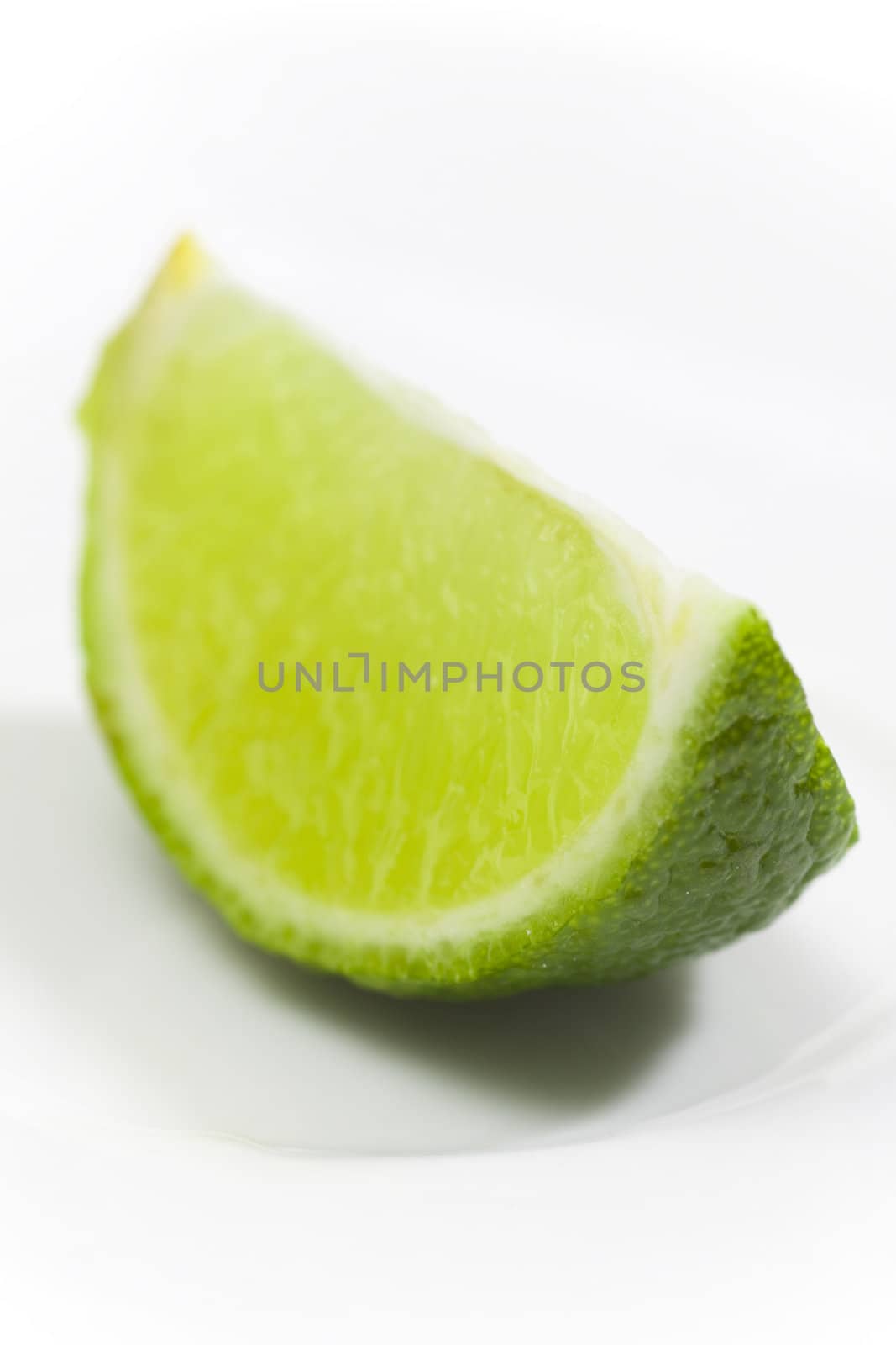 Fresh lime on white plate