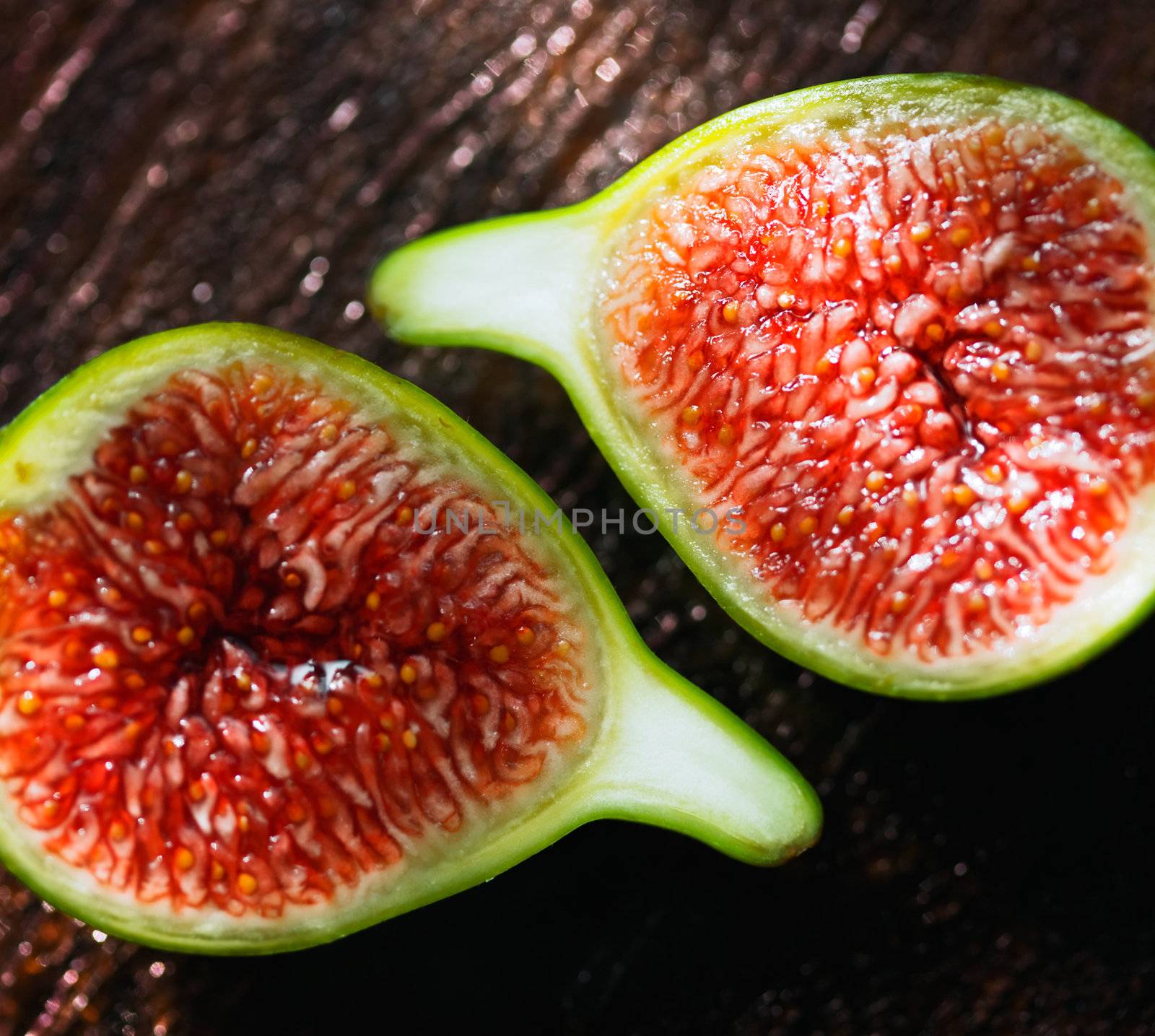 Delicious vibrant honey sweet green fig. Figs halved