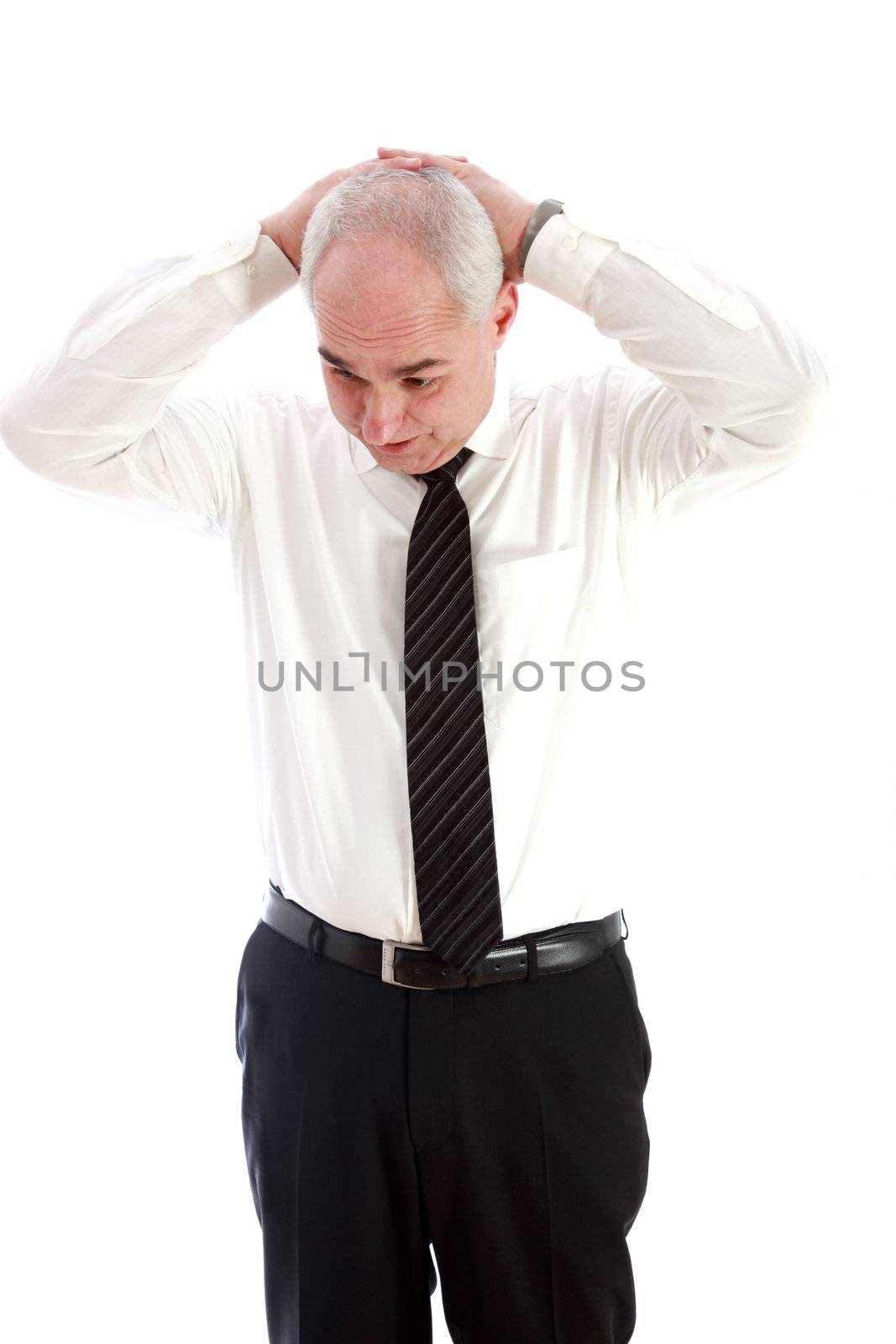 An elderly businessman who is stressed out. He claps his hands over his head.