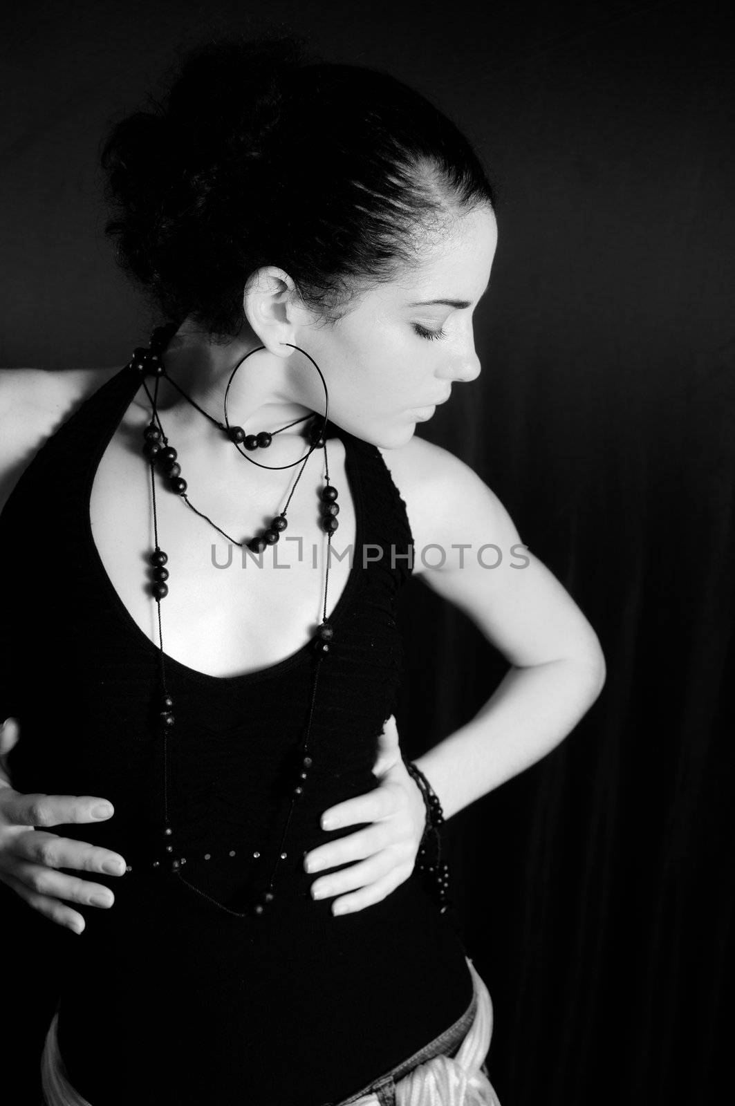 Portrait of young hispanic woman in black and white