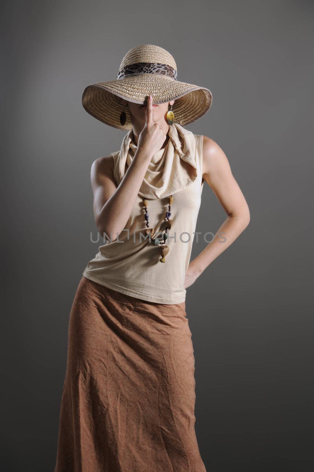 Portrait of young fashionable woman with hat in retro style