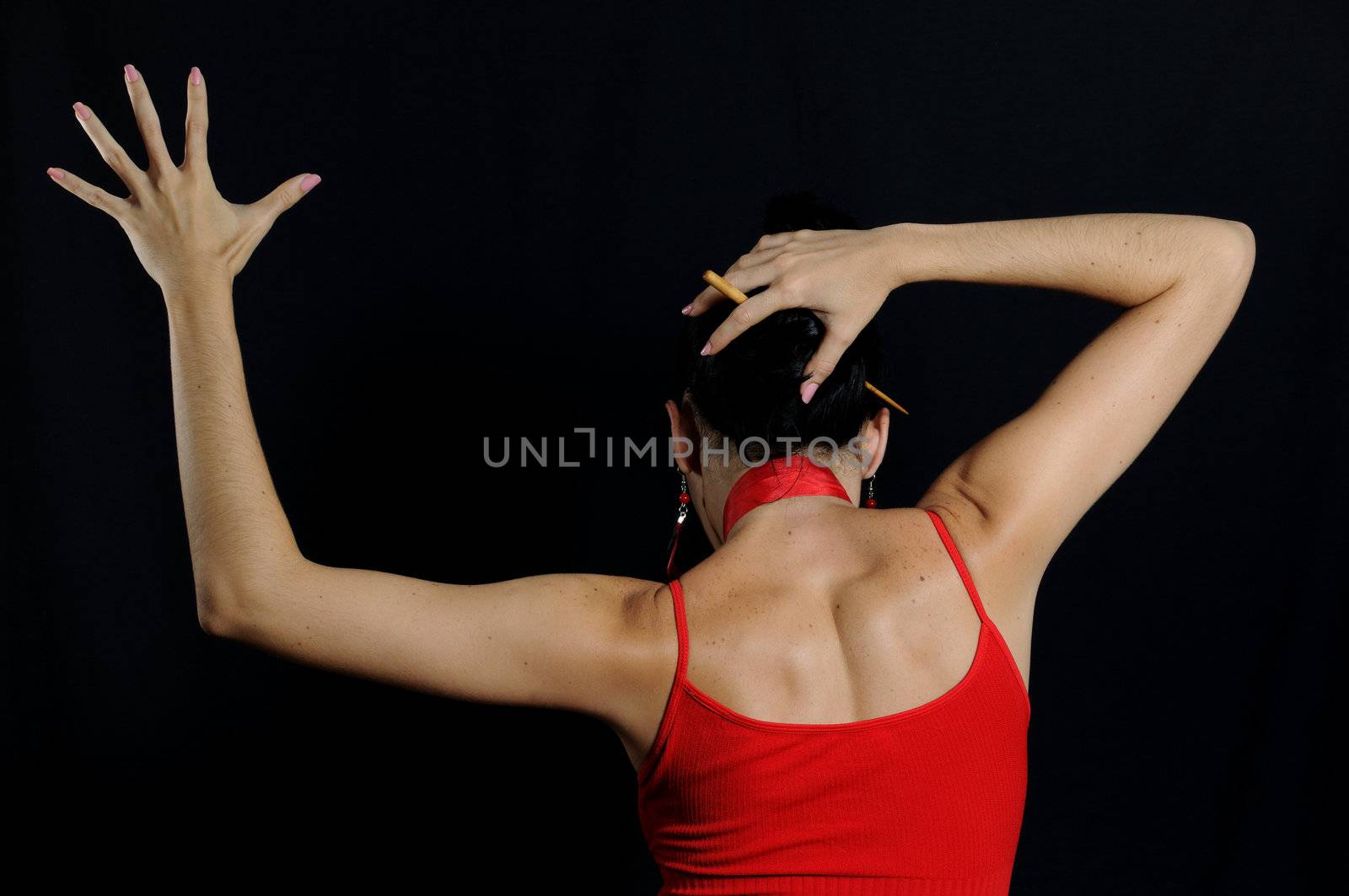 Portrait of passionate flamenco dancer isolated on black