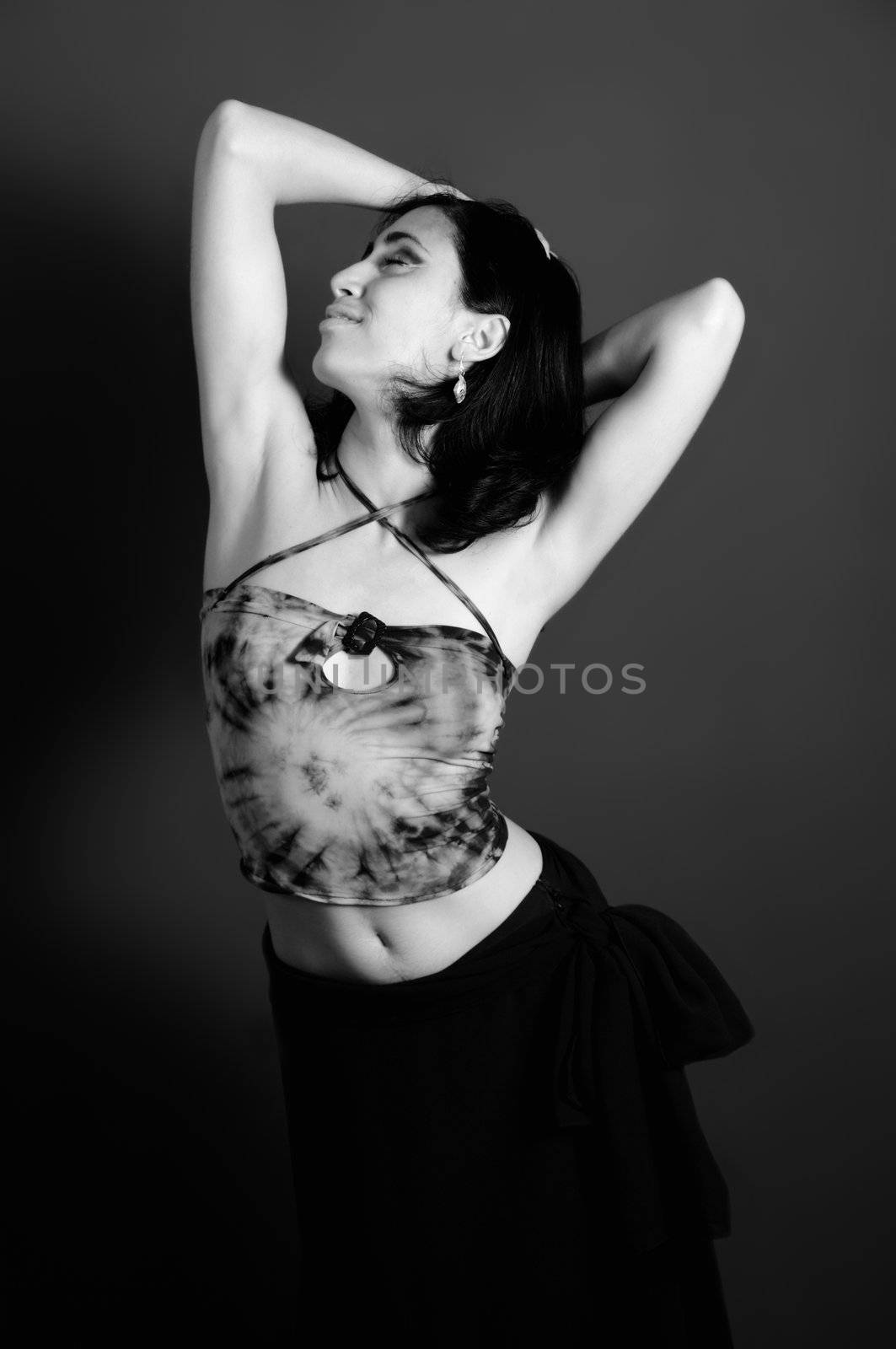 Portrait of young woman in contemporary dance pose