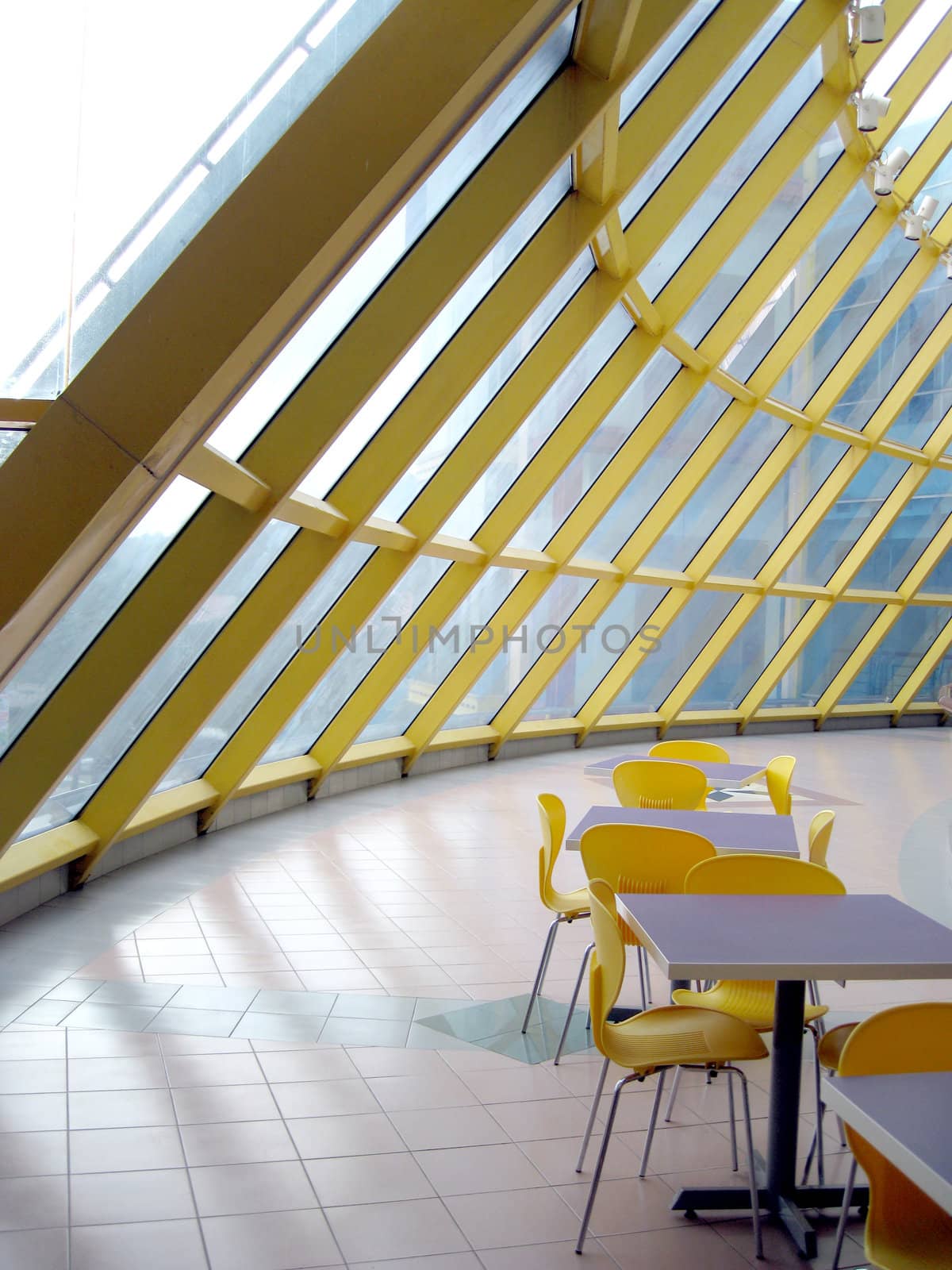 a corner cafe with a glass roof