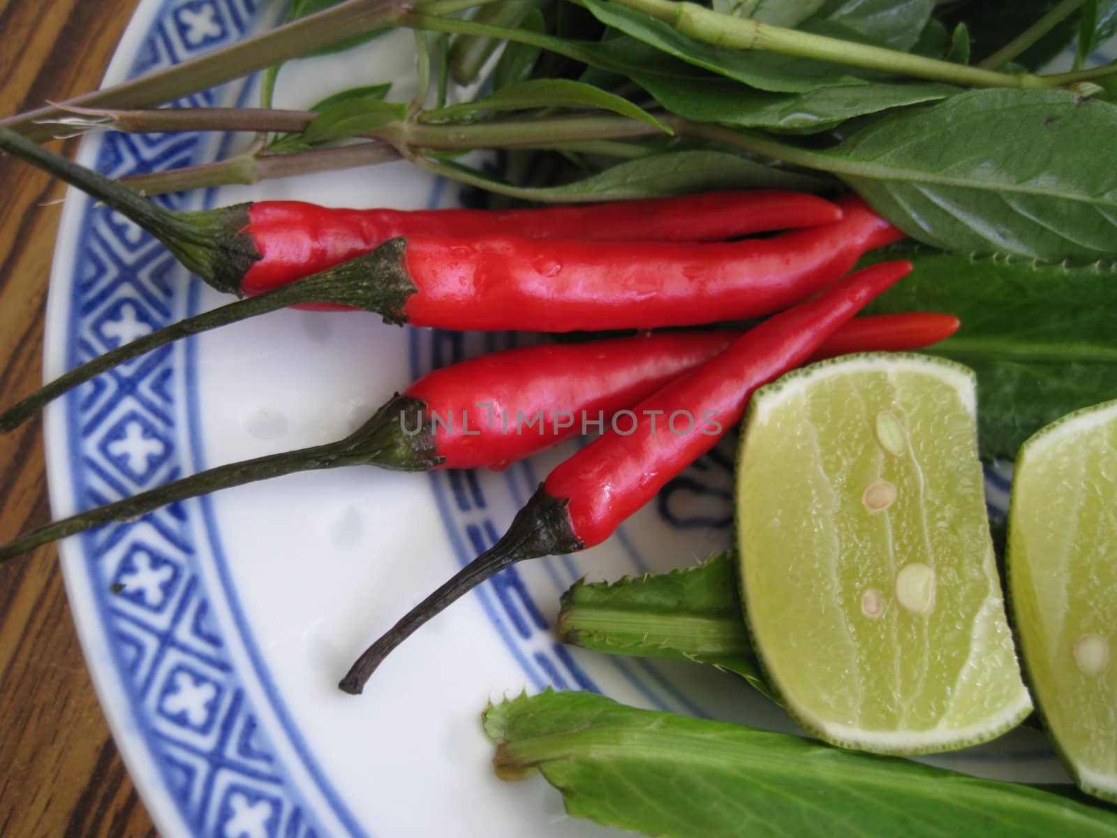 close up for chilies , limes and herbs