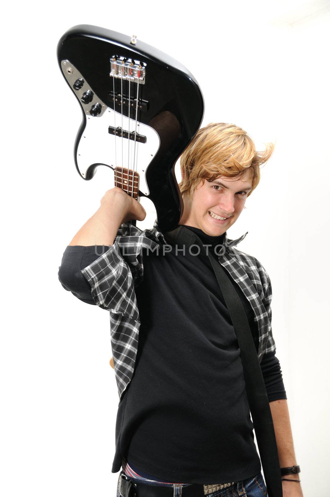 Portrait of young trendy man holding his electric bass - isolated