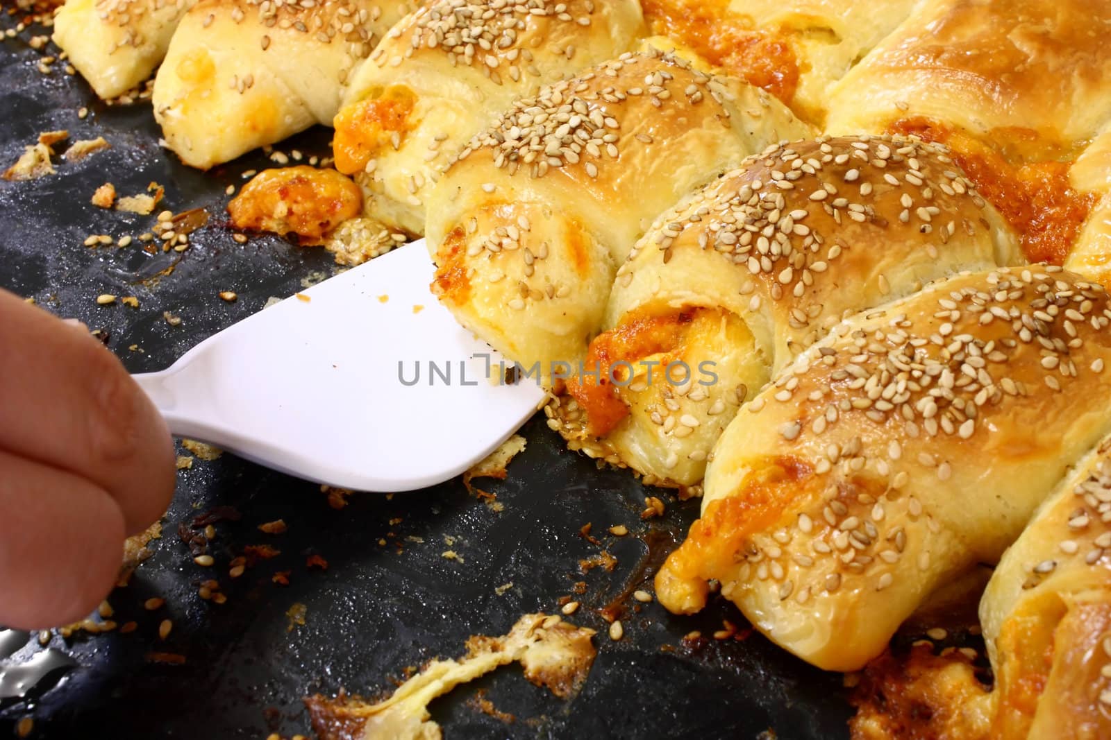 Hot fresh baked pastry with sesame seeds, in a pan