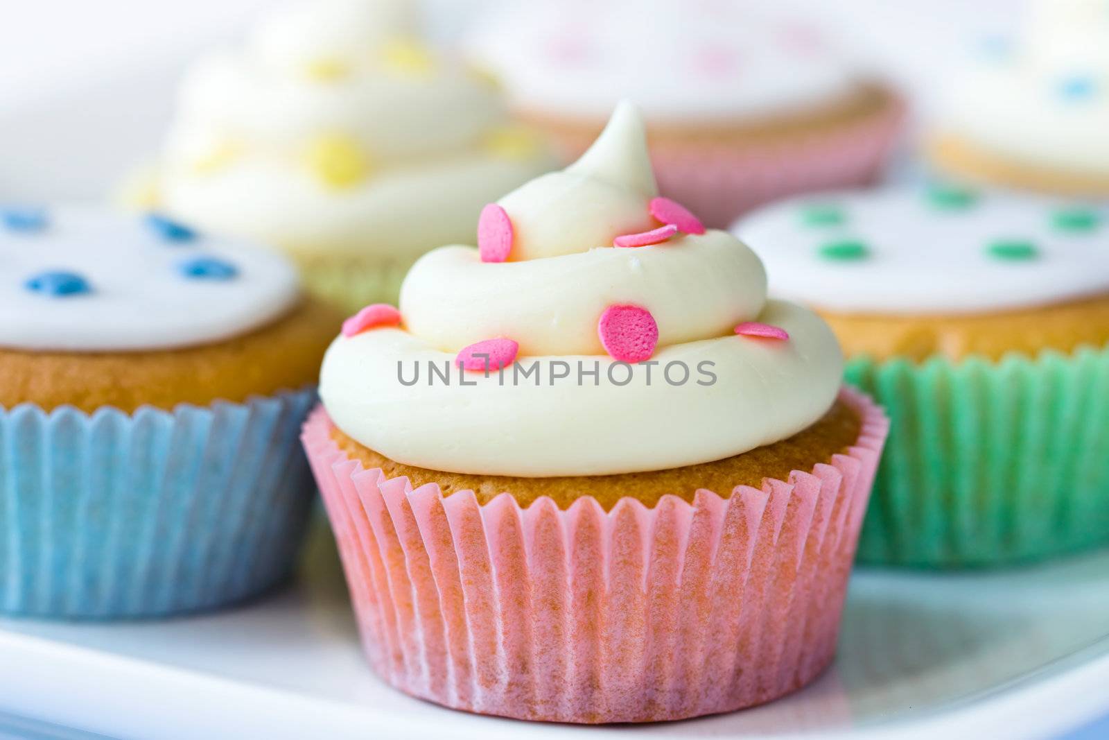 Selection of colorful cupcakes on a plate