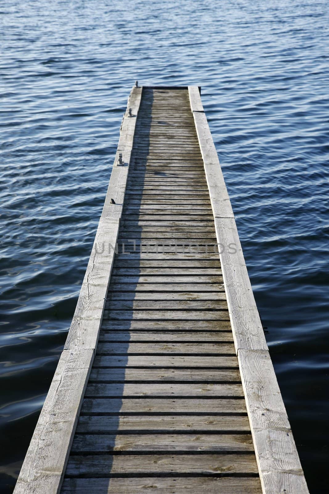 Beautiful lake scene of a wooden pier