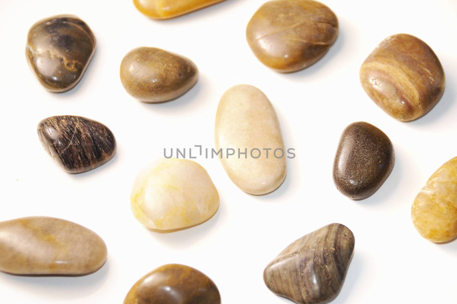 Isolated assorted pebbles background