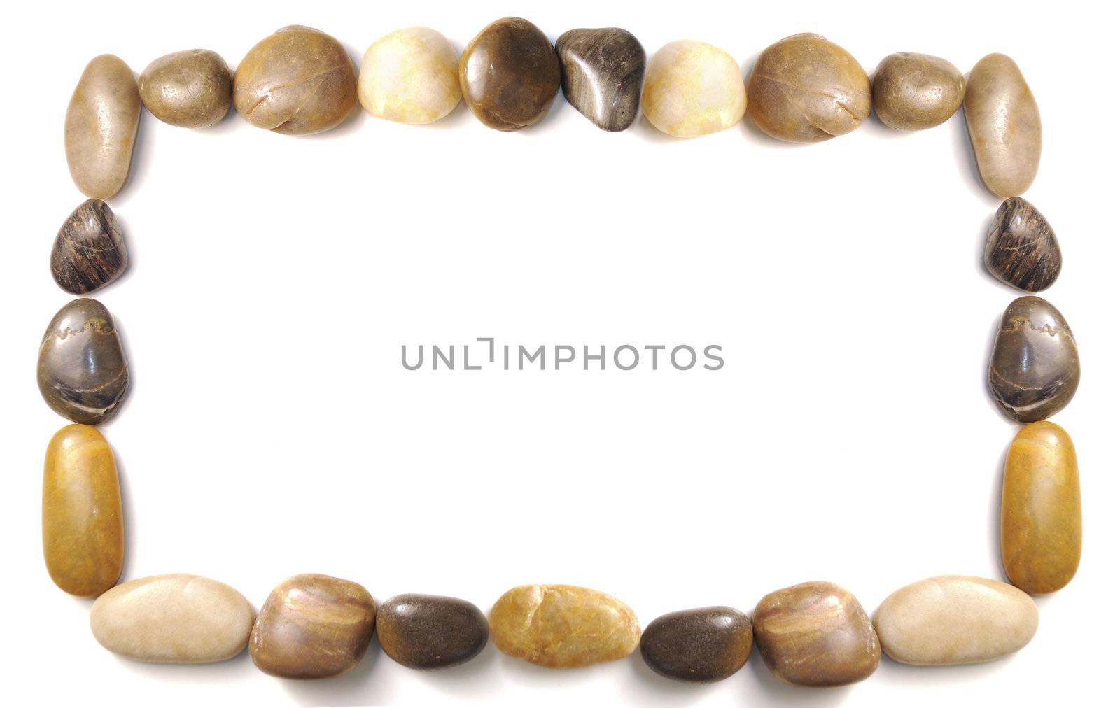 assorted pebbles forming and border over white background