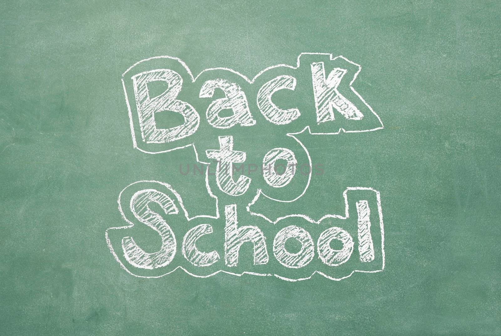 large XXL image of an old chalkboard with the phrase Back to school written on it
