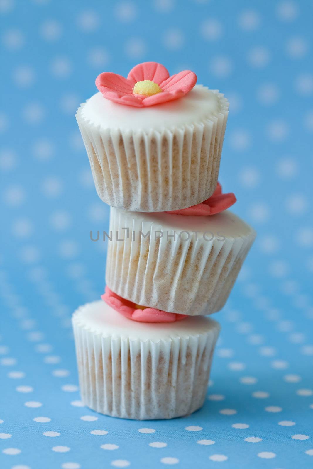 Three cupcakes arranged in a stack