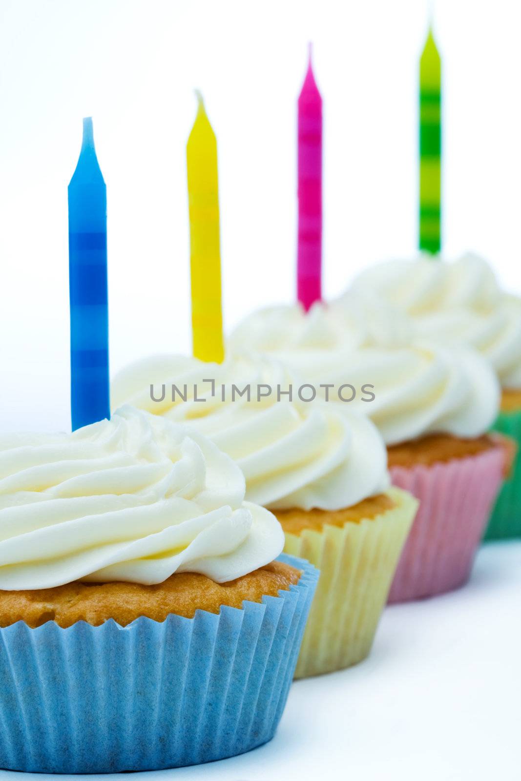 Row of birthday cupcakes by RuthBlack