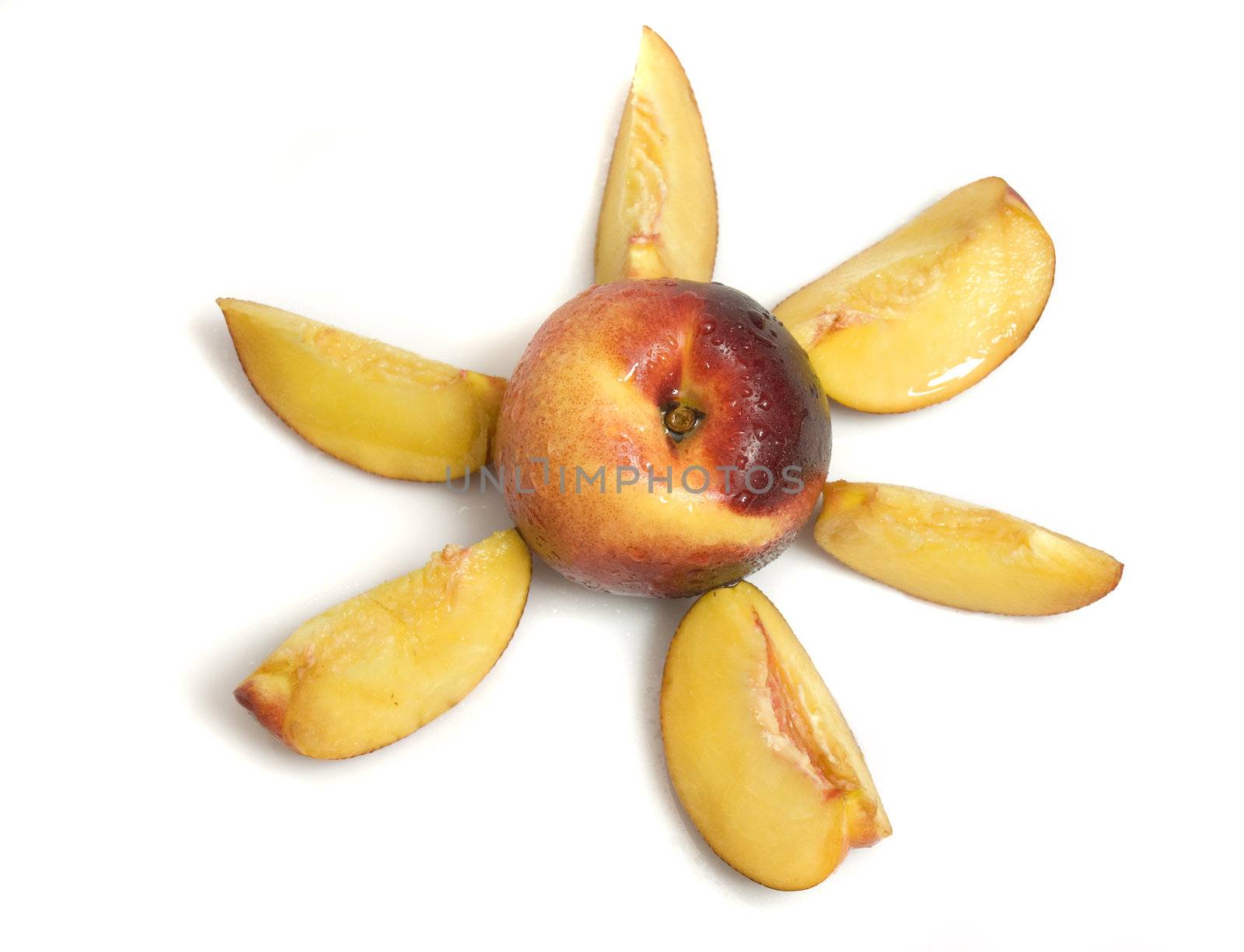 arrangement of fresh organic nectarines in a happy sun shape, isolated on white