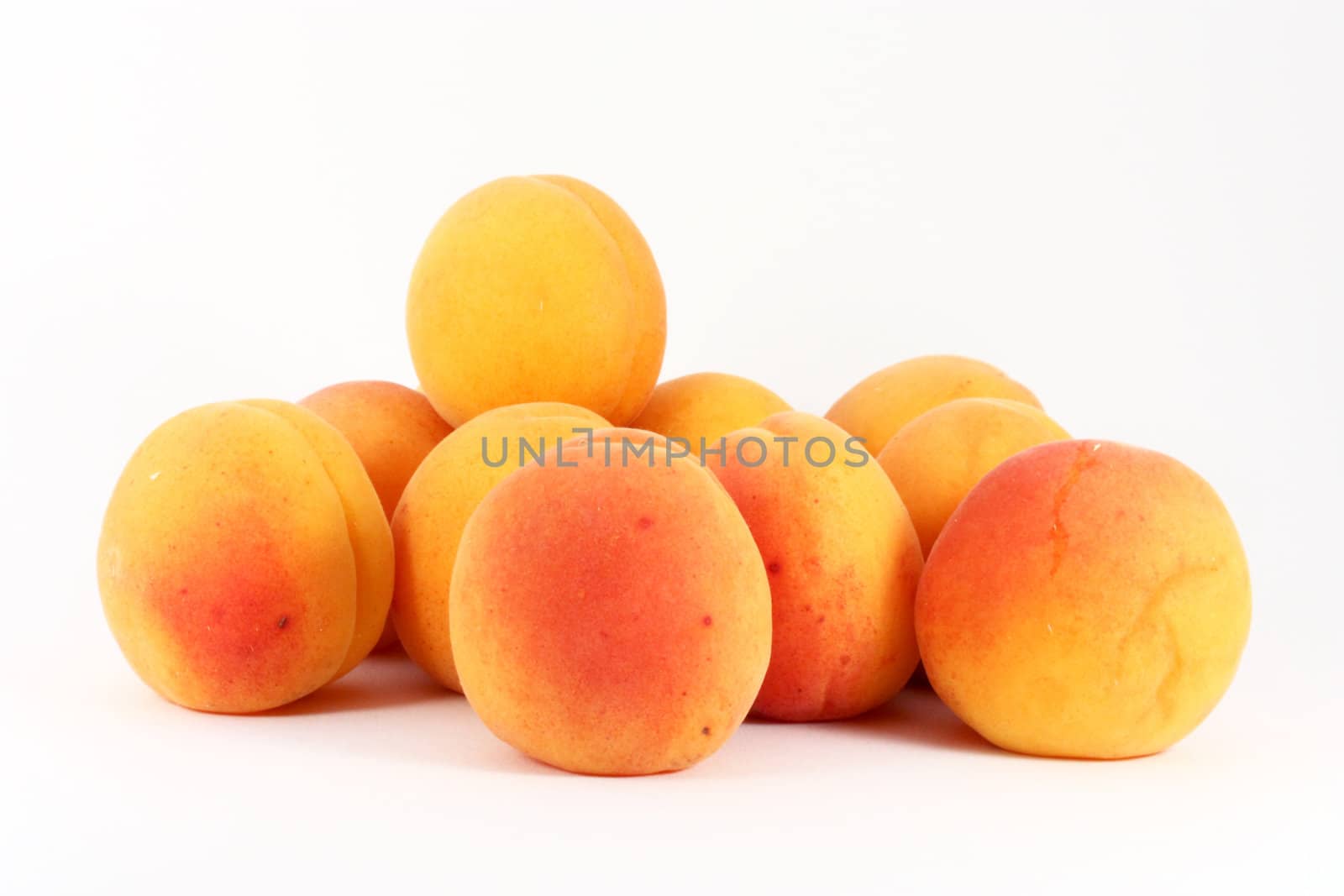 Fresh ripe colorful apricots isolated