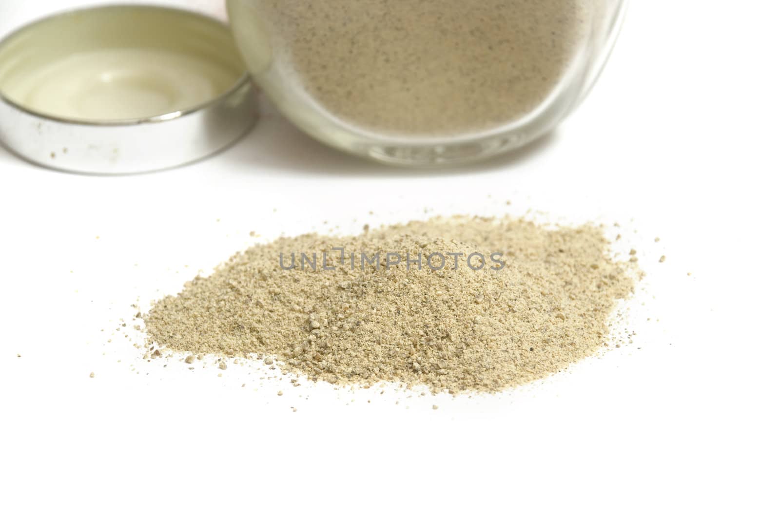 close-up on white pepper powder, isolated on white