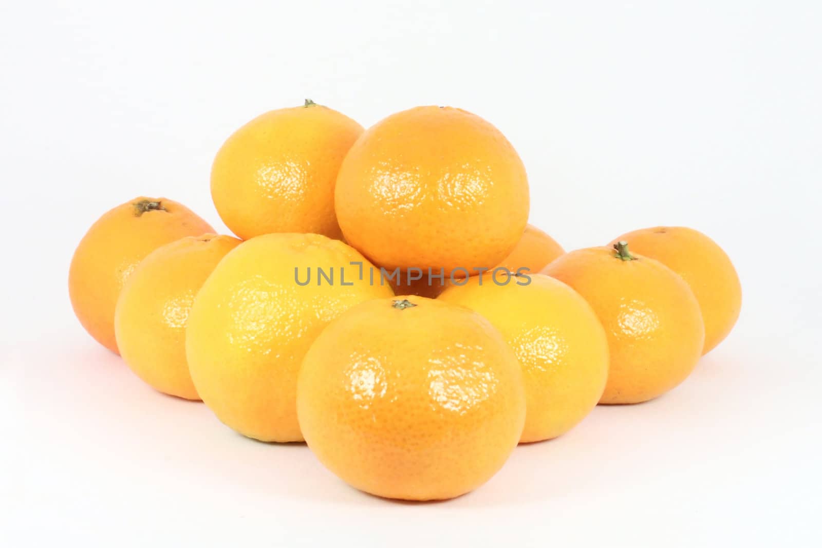 Stack of oranges isolated on white