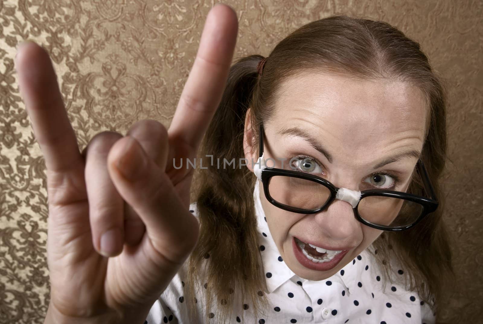 Cute Nerdy Girl Making Bull Horns Gesture