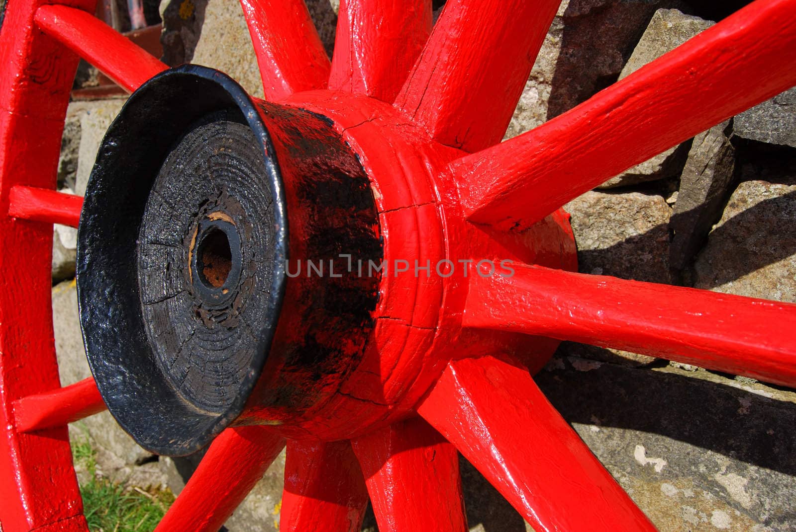 closeup of a red and black painted cartwheel