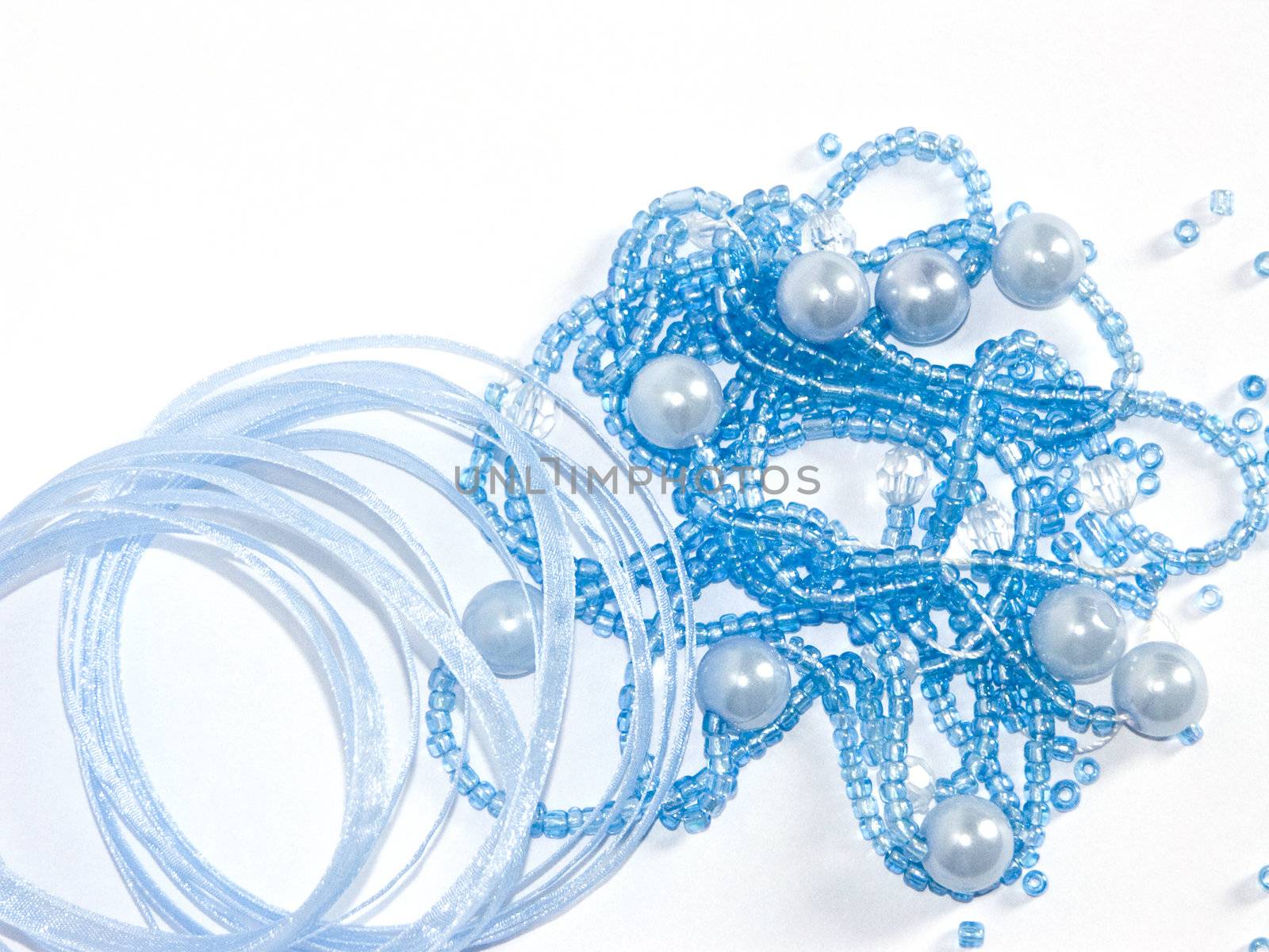 The image of the torn beads and a kapron tape on a white background
