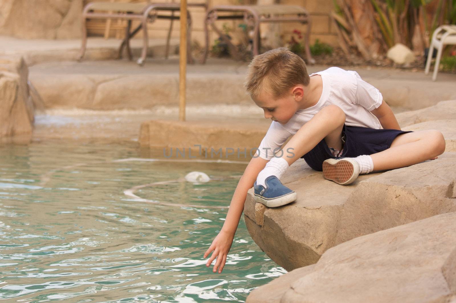 Young Boy Portrait Near Swimming Pool