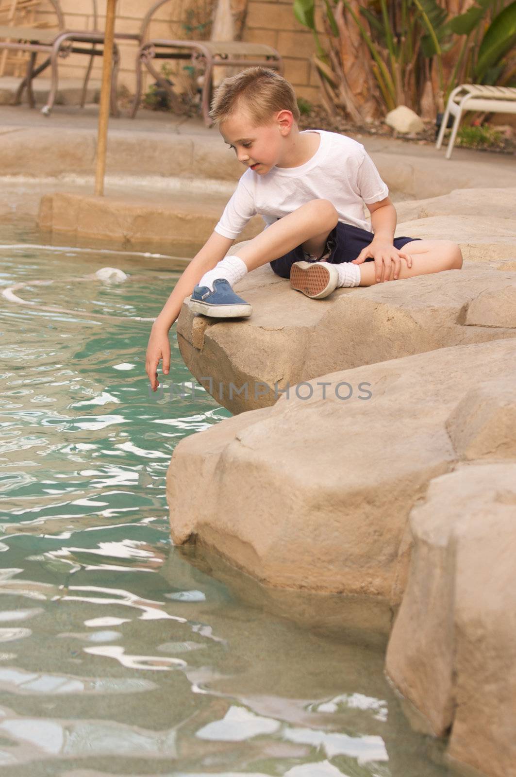 Young Boy Portrait Near Swimming Pool