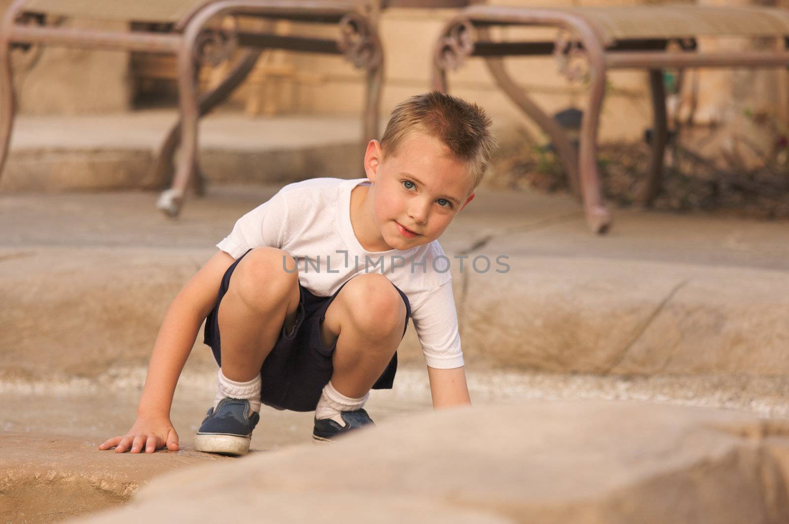 Young Boy Portrait Near Swimming Pool