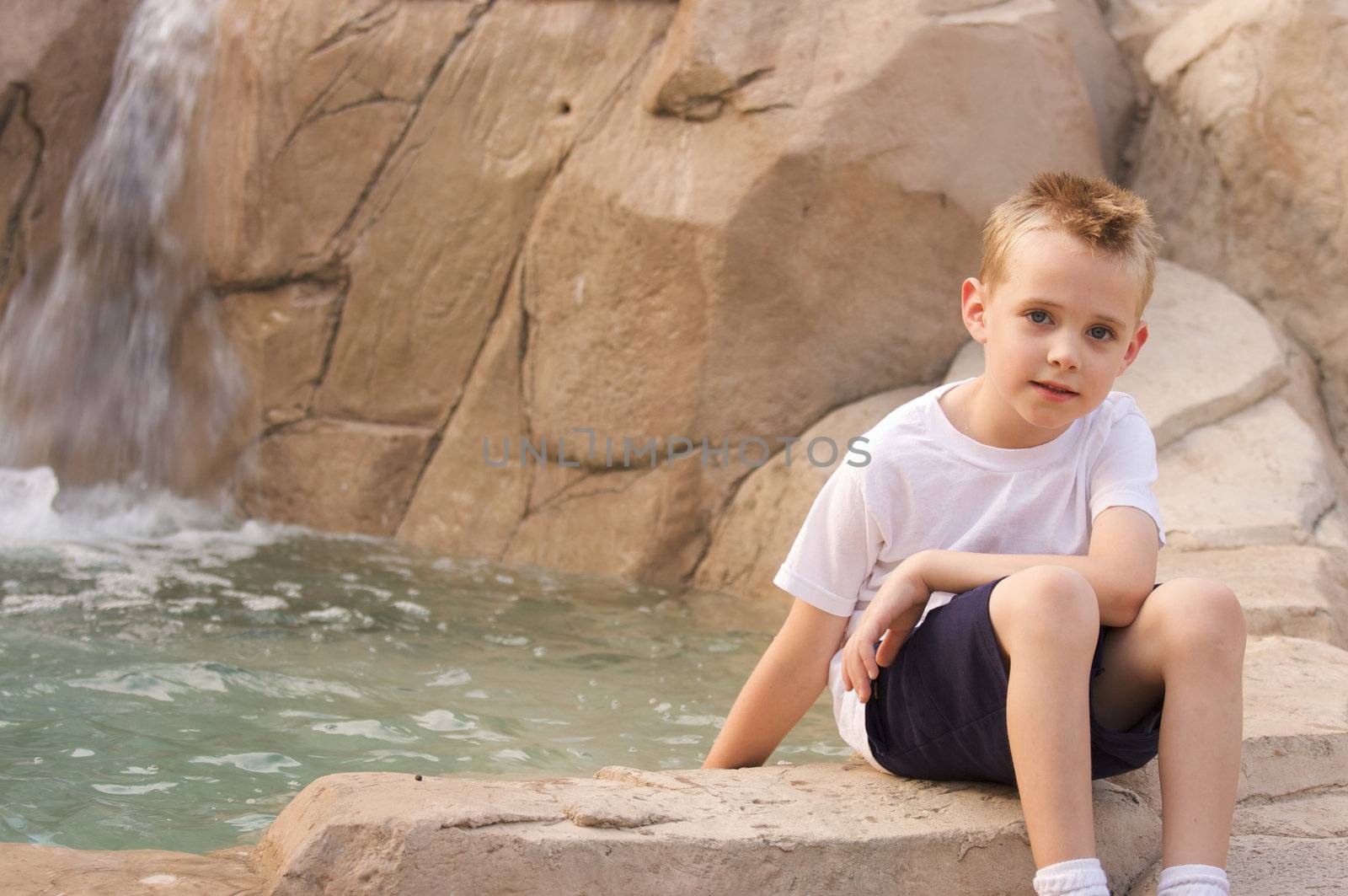 Young Boy Portrait Near Swimming Pool