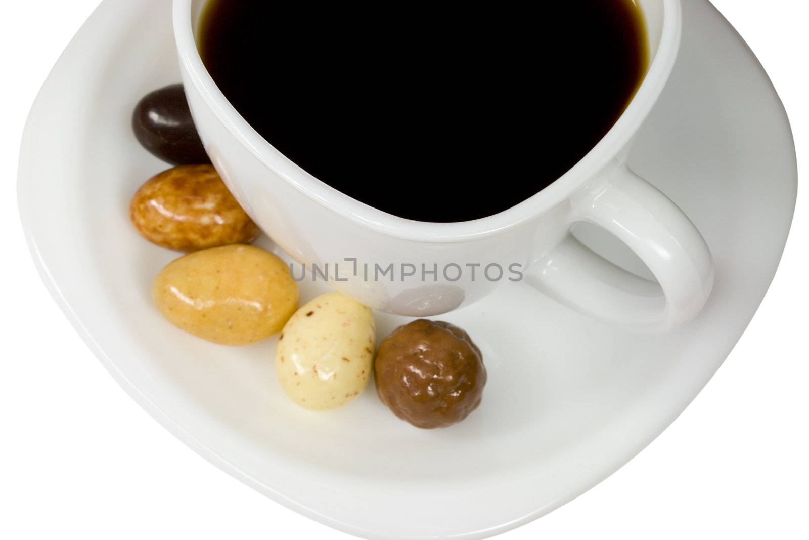 white cup of coffee with candies by Alekcey