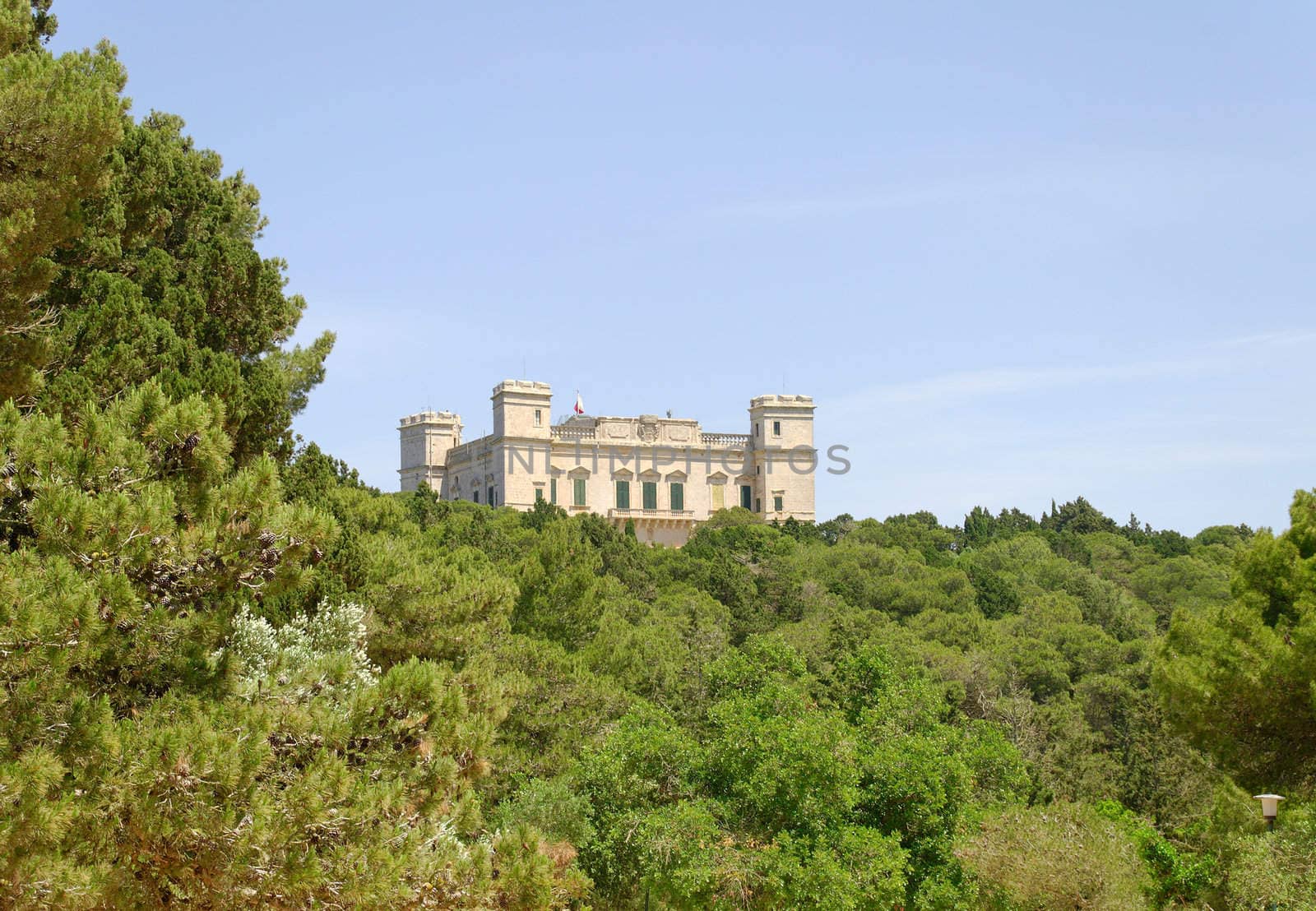 Verdala Palace on Malta, seen through the green of the small forest - Buskett
