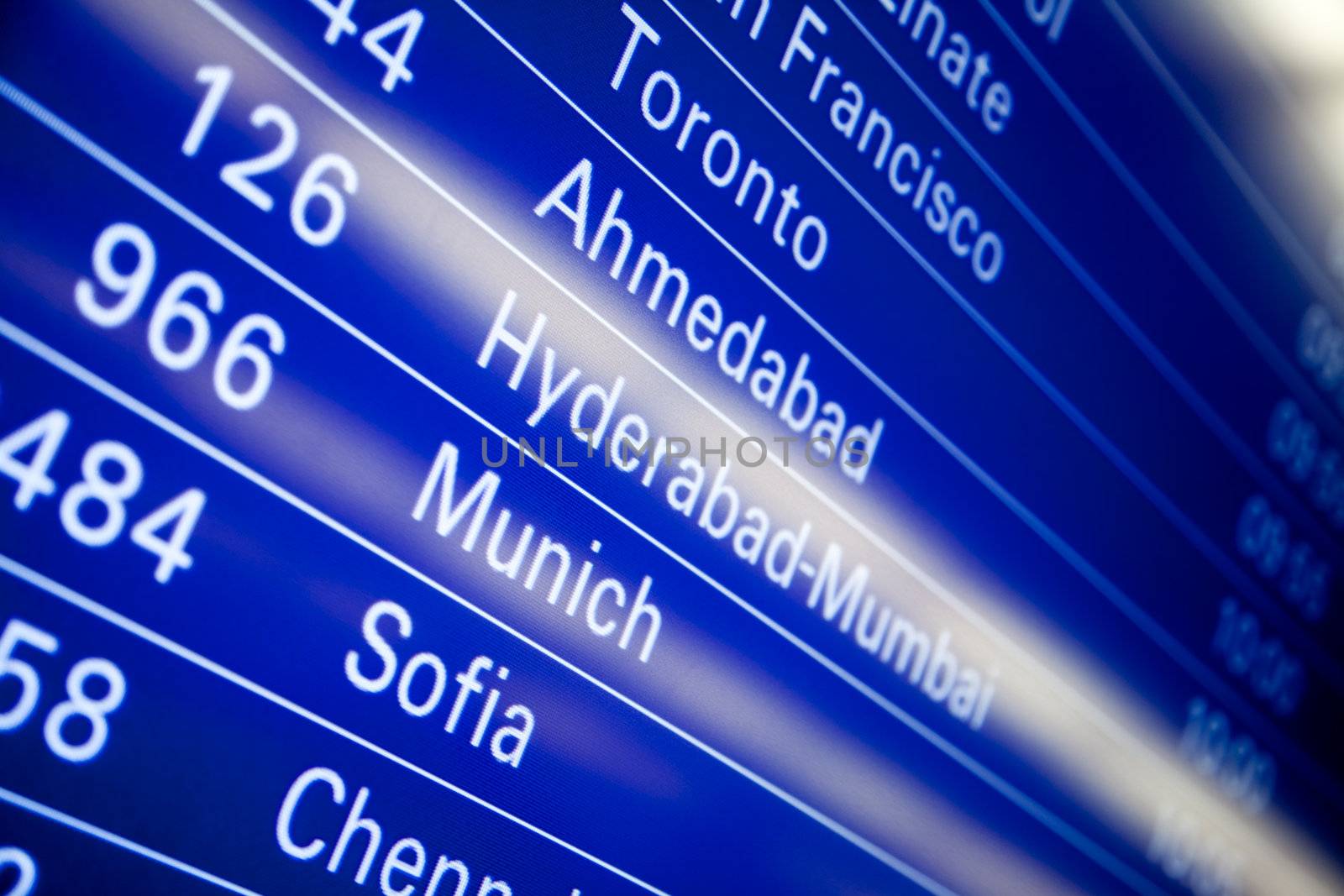 Blue flight information board in airport, selective focus