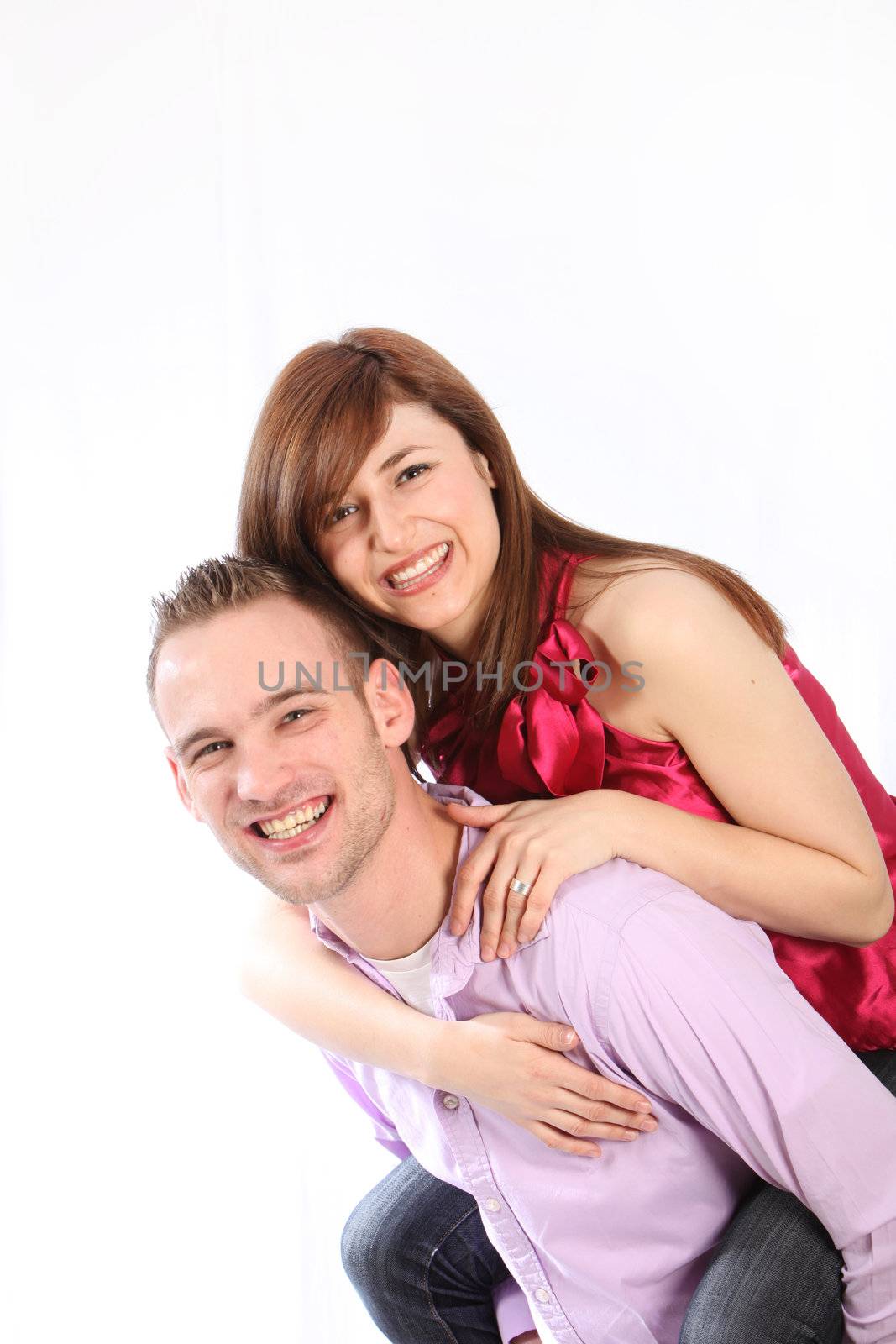 Young, smiling couple. He wears them on his back