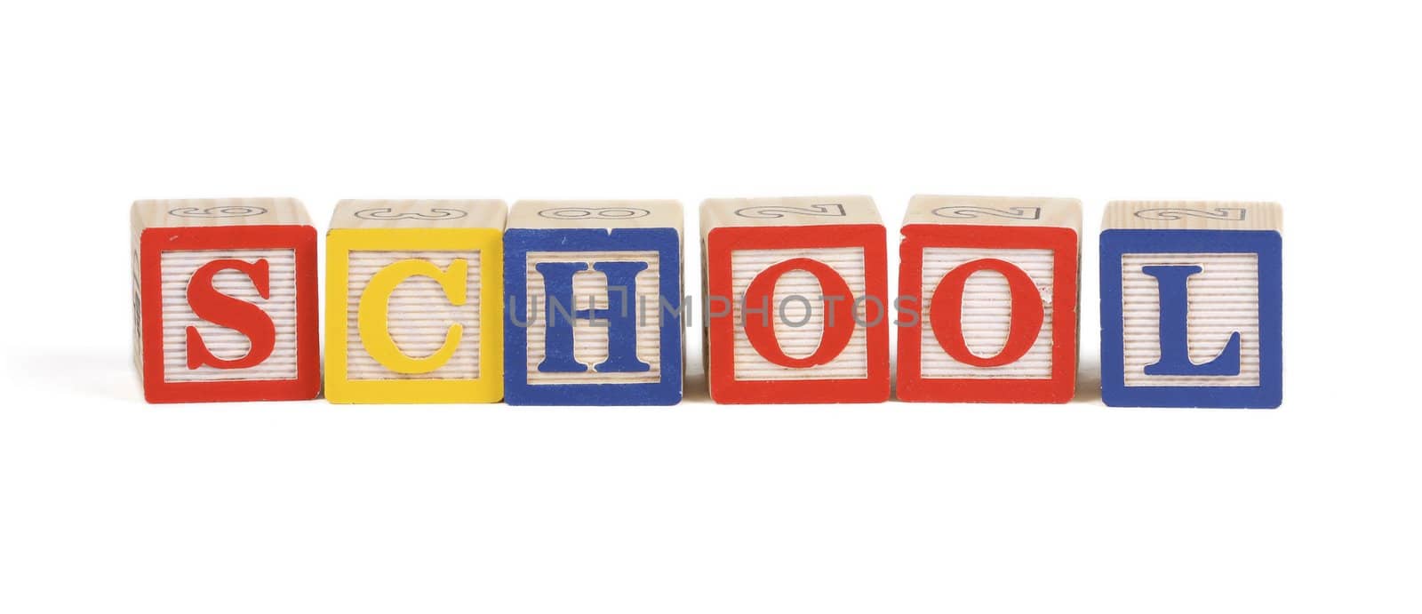 Alphabet blocks lined up to spell School - isolated on white