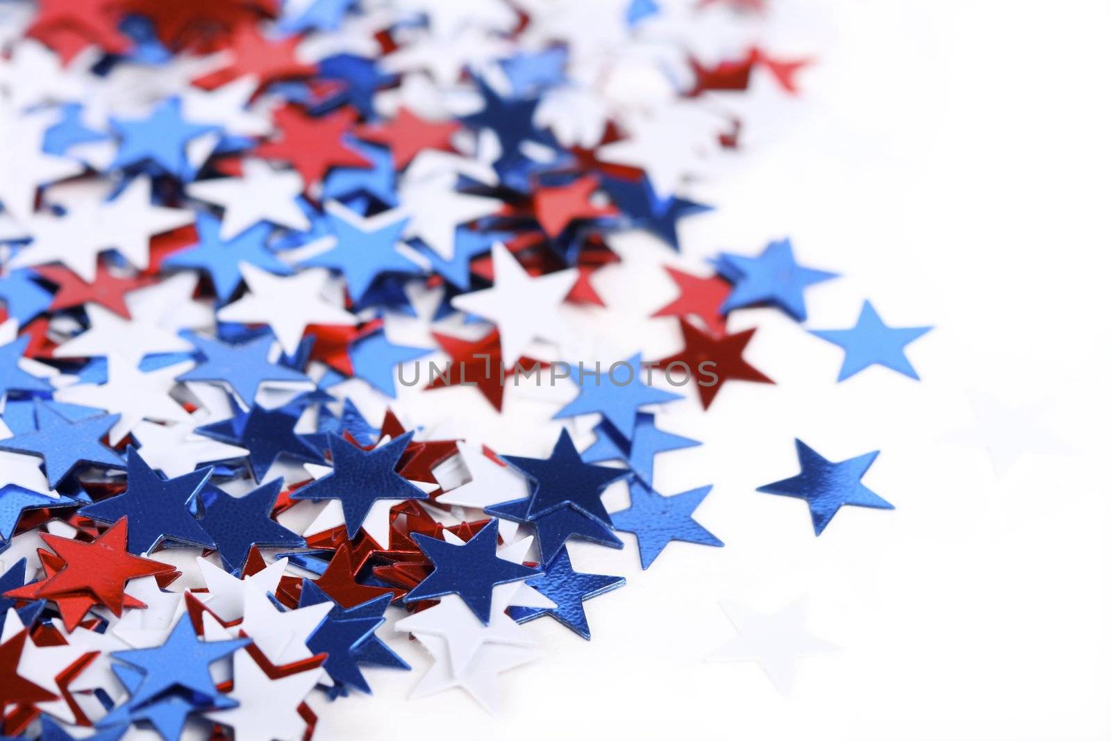 Star shaped confetti - perfect as a election or 4th of july background - focus on stars in front