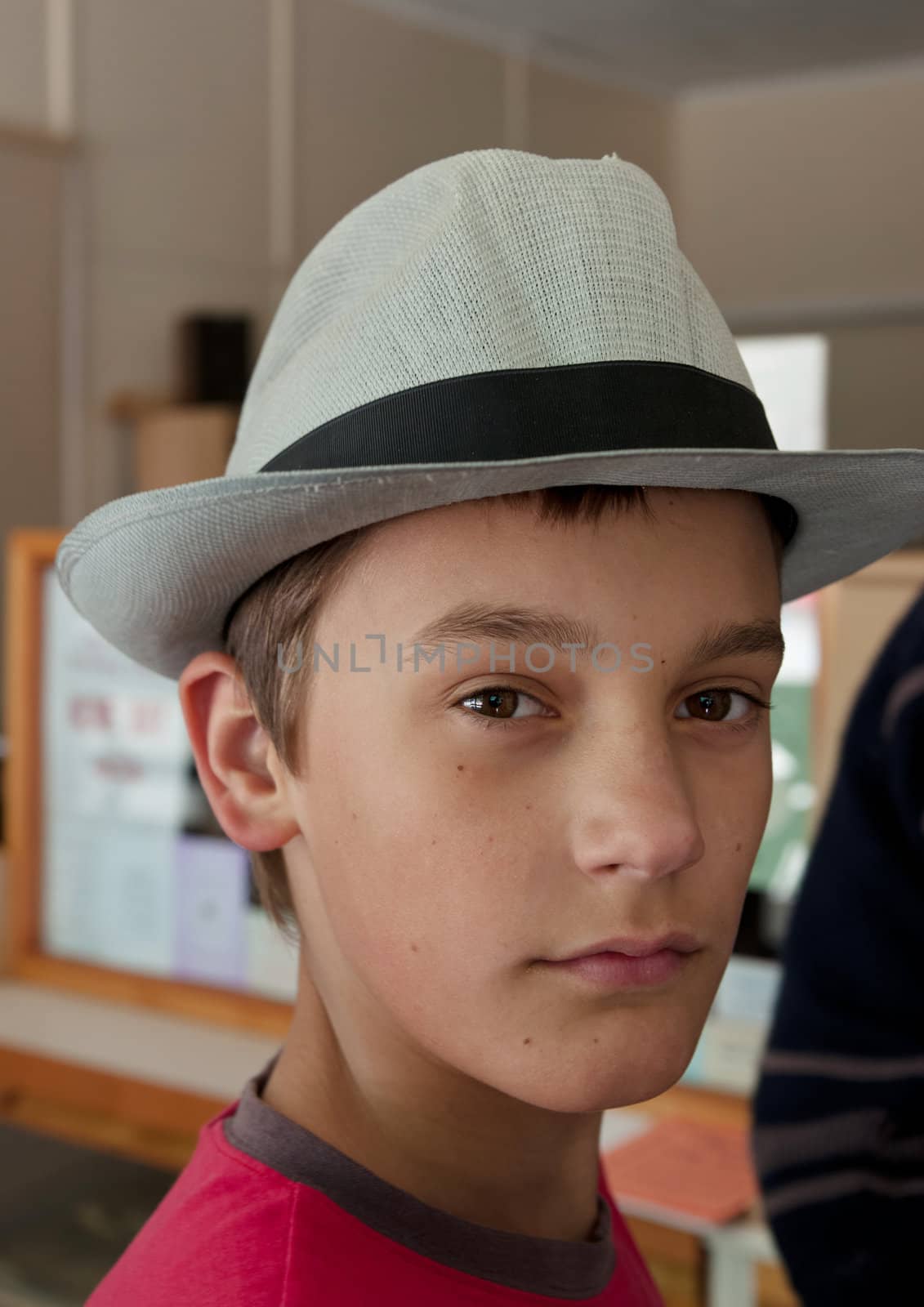 this young boy tries on a hat