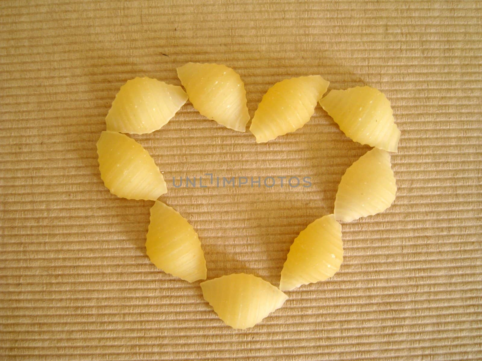 top view of a love shape made by pasta shell